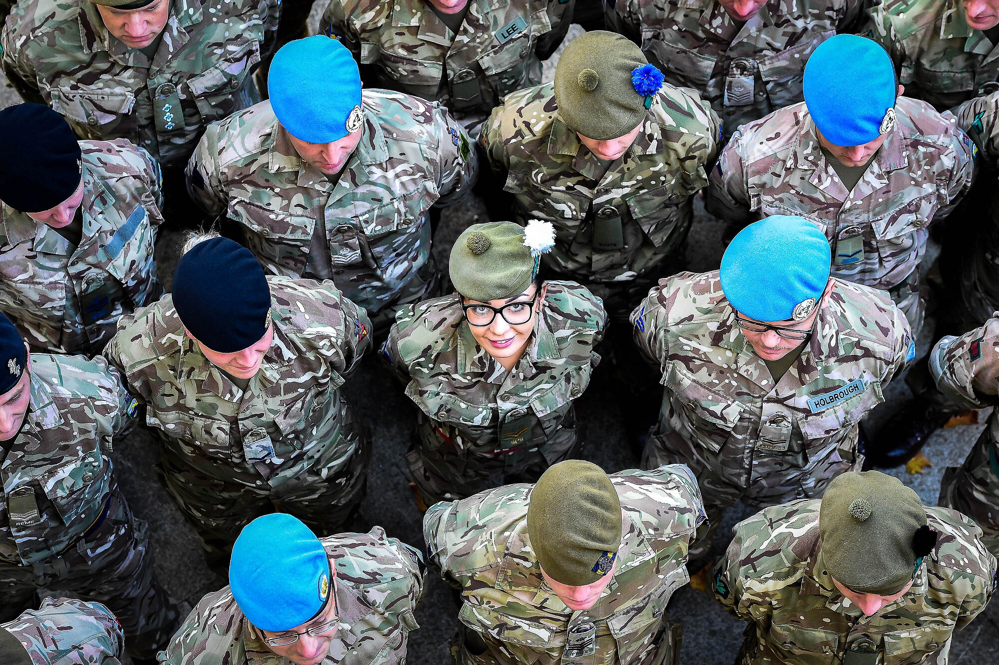  Corporal Chloe Fitton, 2 Scots, surrounded by comrades from various regiments taking part in the march to Parliament by 120 Army personnel representing the 51,726 soldiers who deployed last year to more than 55 countries on operations, defence engag