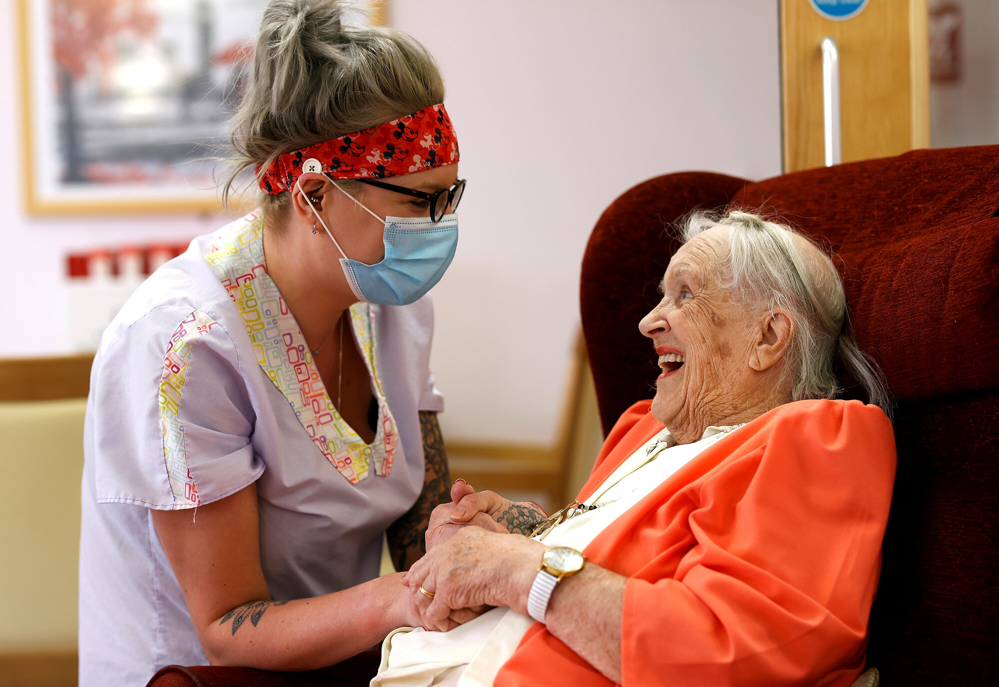  Carer Lucy Skidmore, who remains on site with six colleagues, talks to her 100-year-old great-grandmother and resident Joan Loosley at the Fremantle Trust care home, amid the outbreak of COVID-19 in Princes Risborough. Eddie Keogh/Reuters, 05 May 20