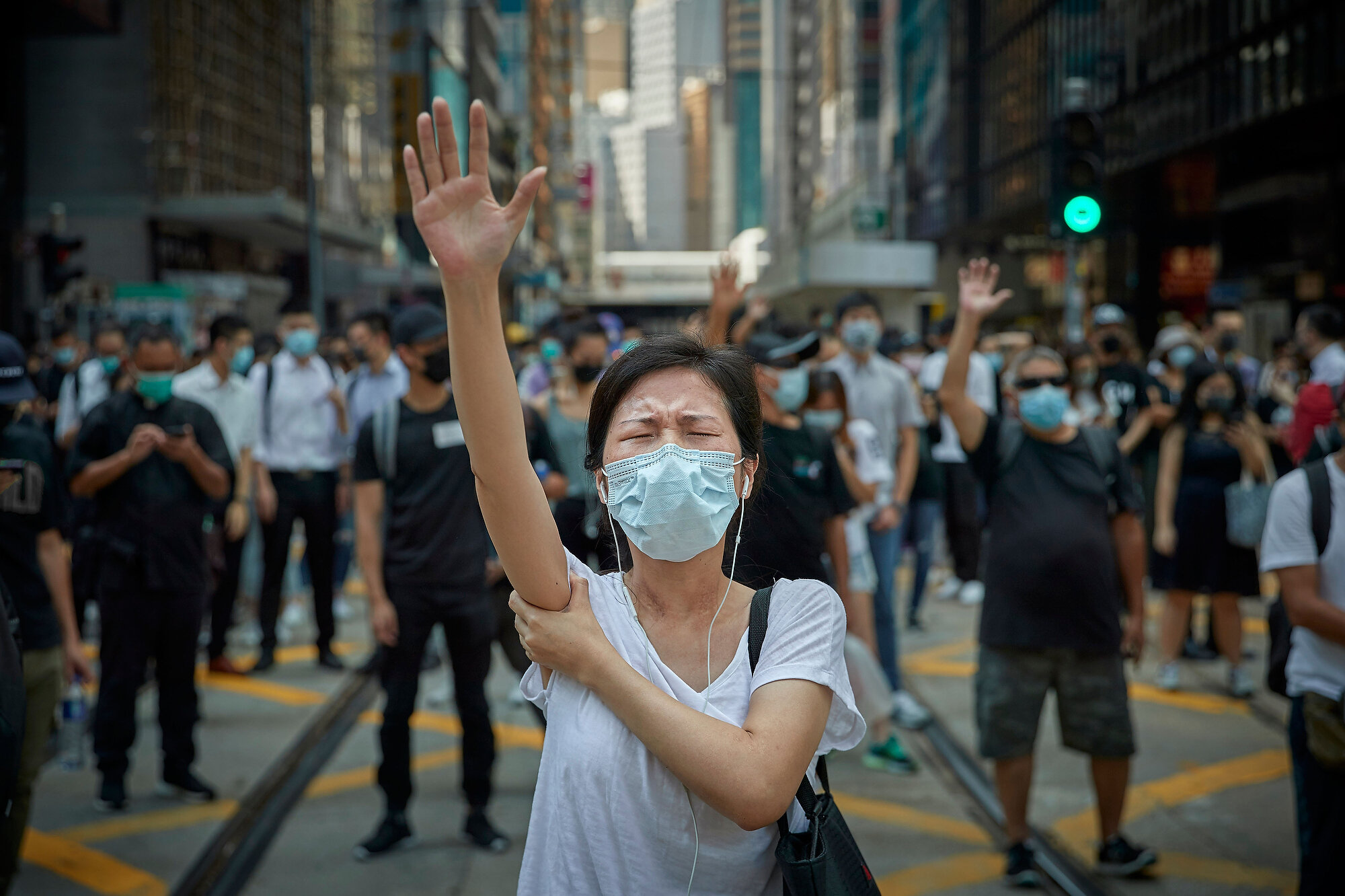  A protestor holds her hand in the air to represent their 'five demands' during a pro-democracy demonstration in Central Hong Kong. Photo: Kiran Ridley, 04 October 2019 