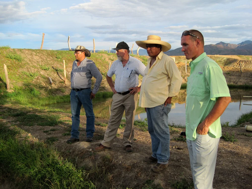 The Keeton Team in Colombia with a tilapia aquaculture farmer