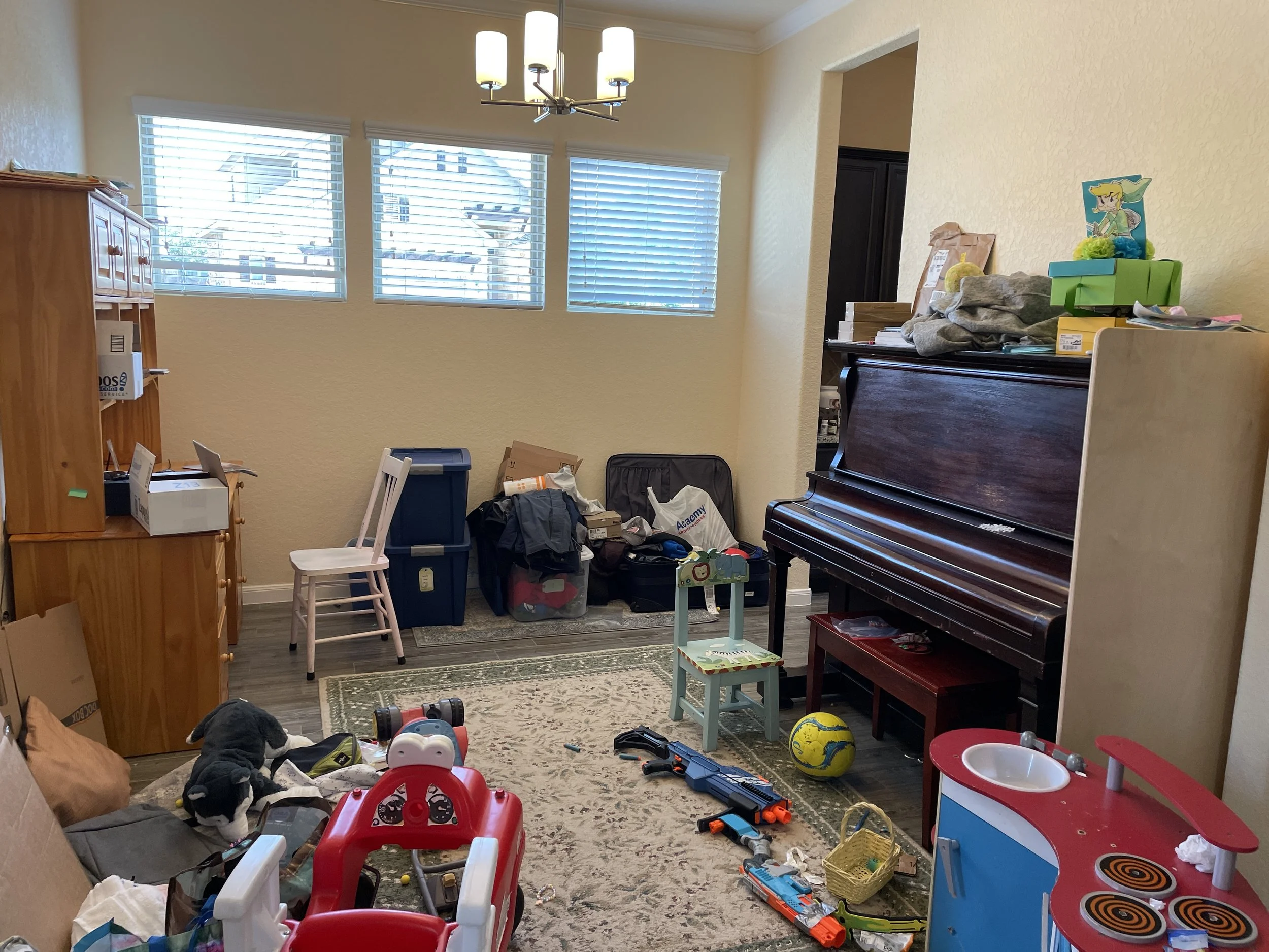 Before picture, cluttered room in San Antonio
