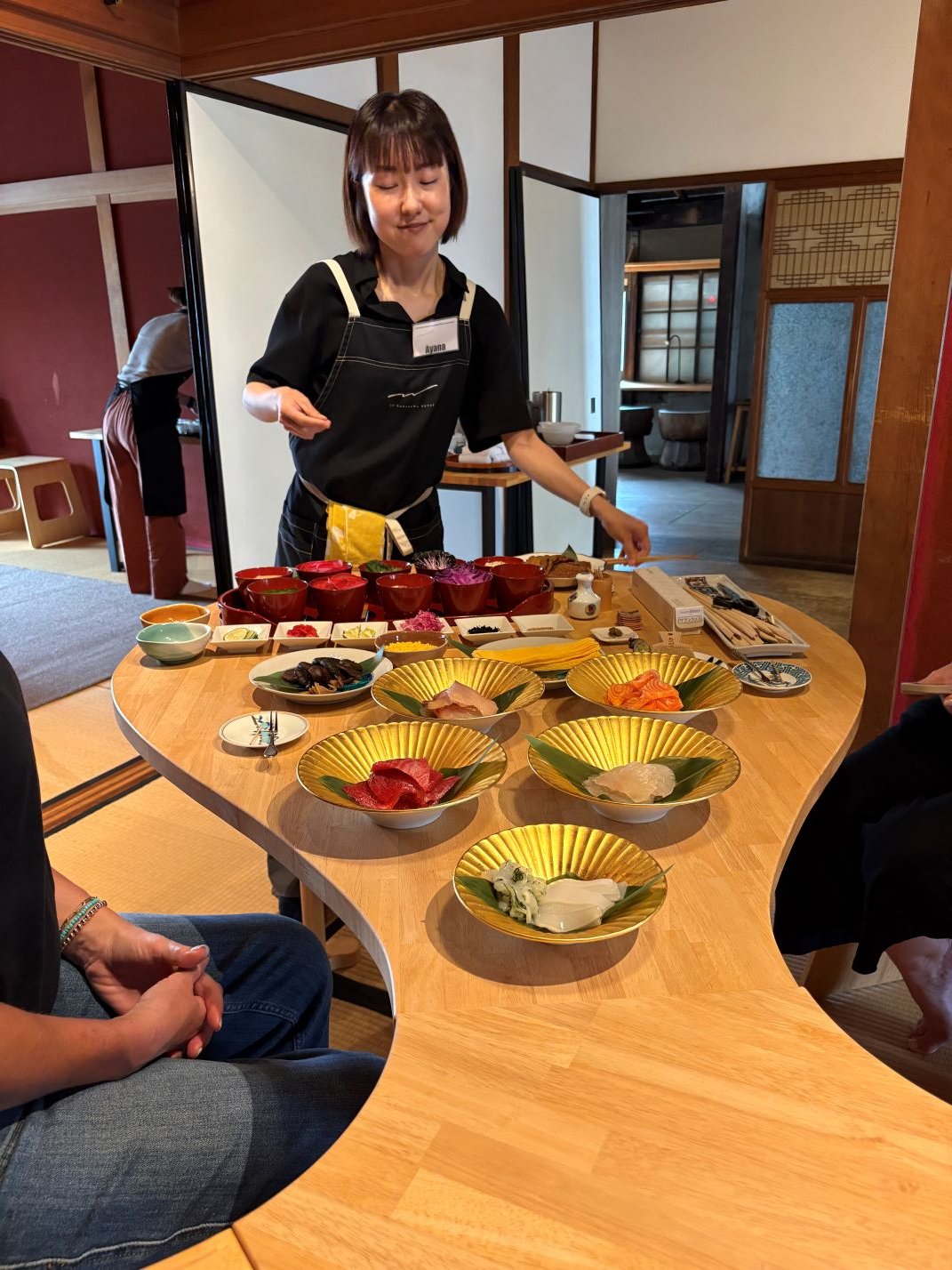Woman prepping sushi ingredients with a beautiful mise en place