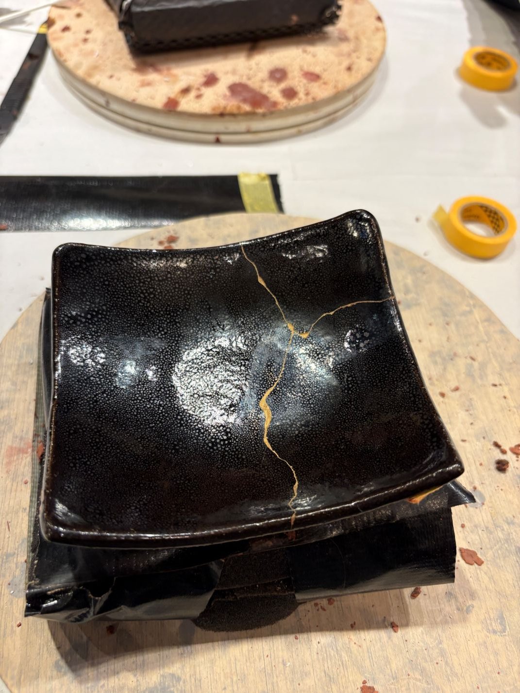 Kintsugi plate, black with gold highlights