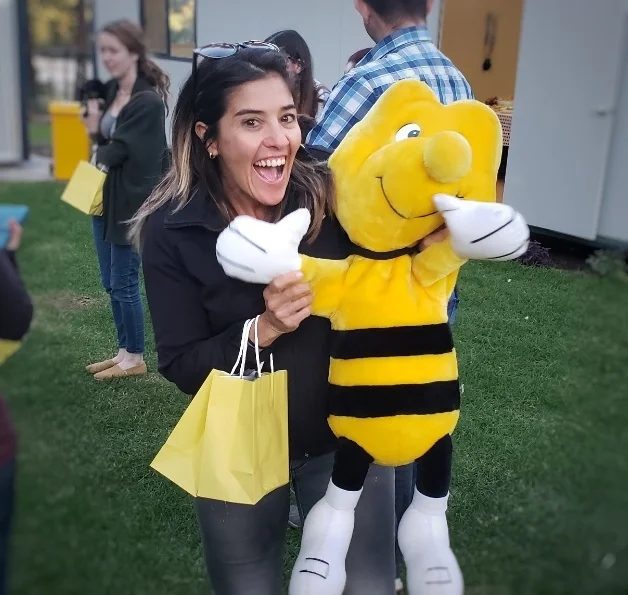 Dani with a bee plush doll.jpeg