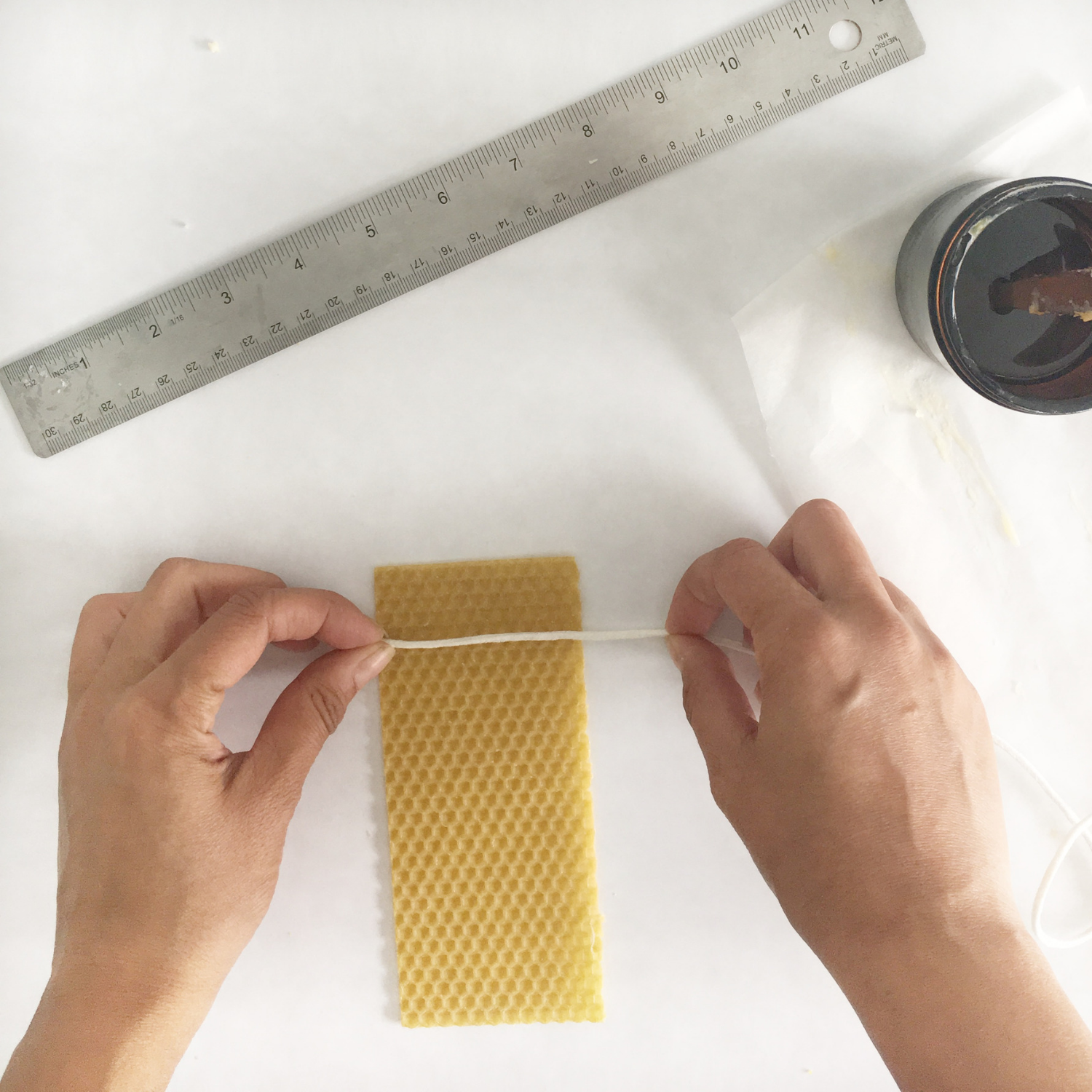 Measure the Wick to the right size before dipping it in wax.