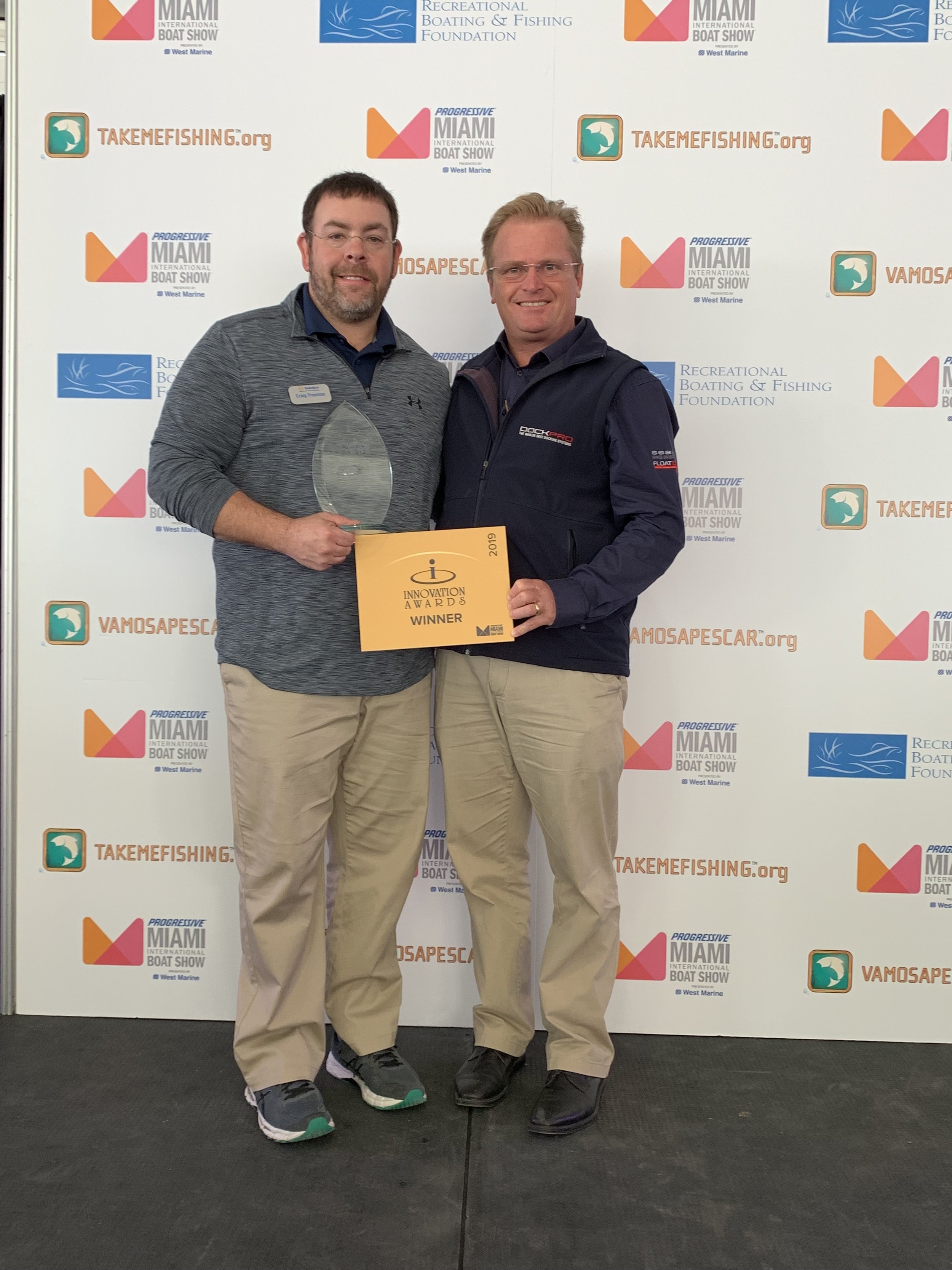 Solstice Docking Director of Sales Craig Freeman and SeaPen inventor Mark Barber accept the 2019 Miami Boat Show Innovation Award.