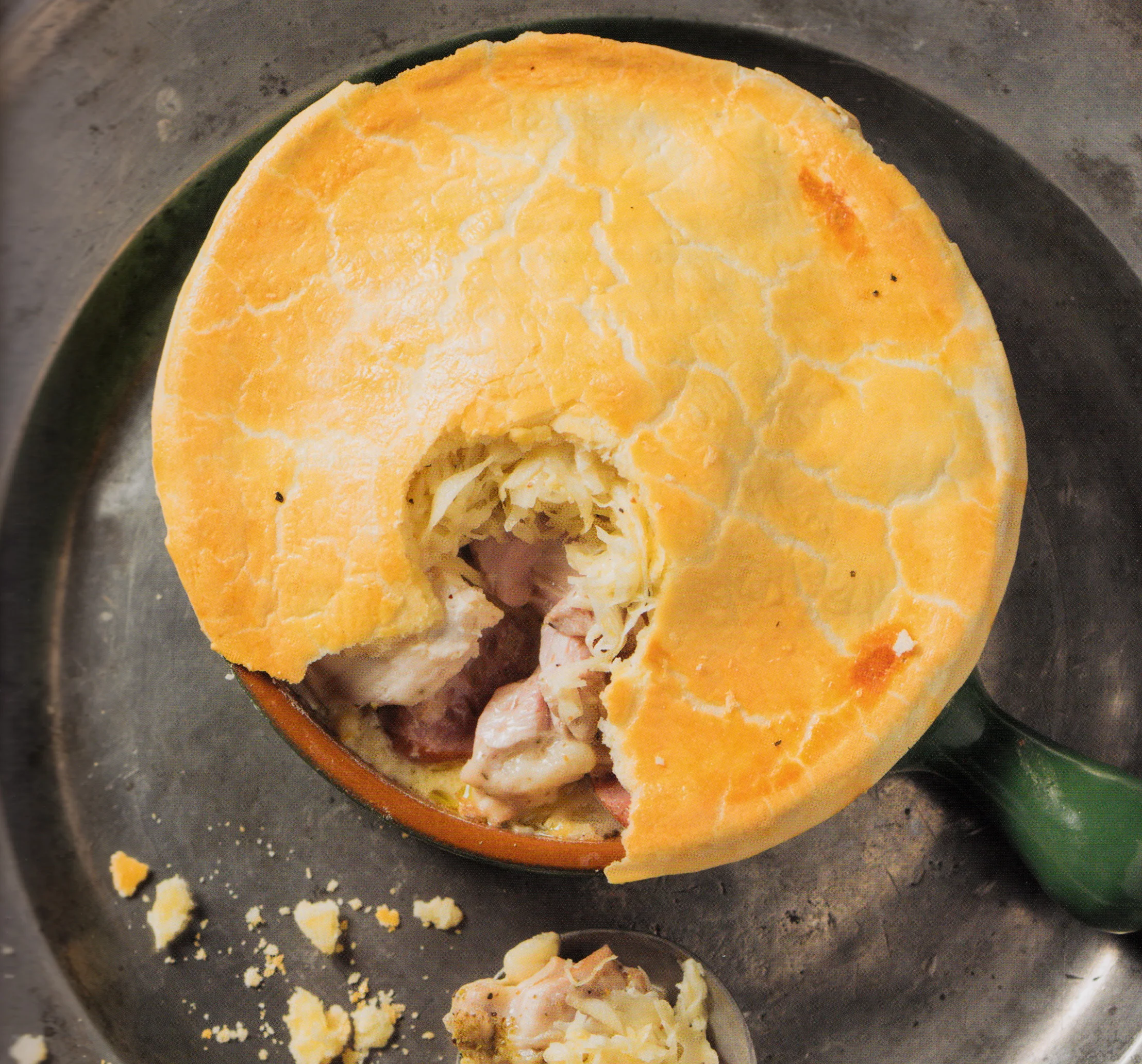 Capon pie with sauerkraut, bratwurst and smoked ribs