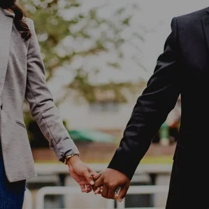 A SPOUSE OF A SENIOR EXECUTIVE