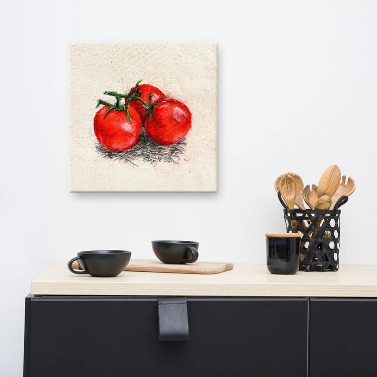 Canvas print of Frank Argento’s drawing of ripe red tomatoes, hung above a kitchen counter