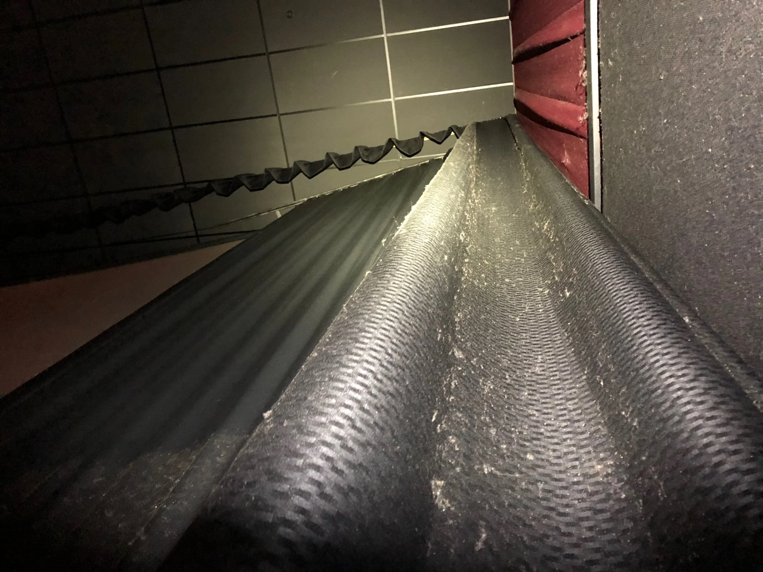 Left Moving Masking Clean. Curtains still covered in contaminants. Taken during our vacuuming process.