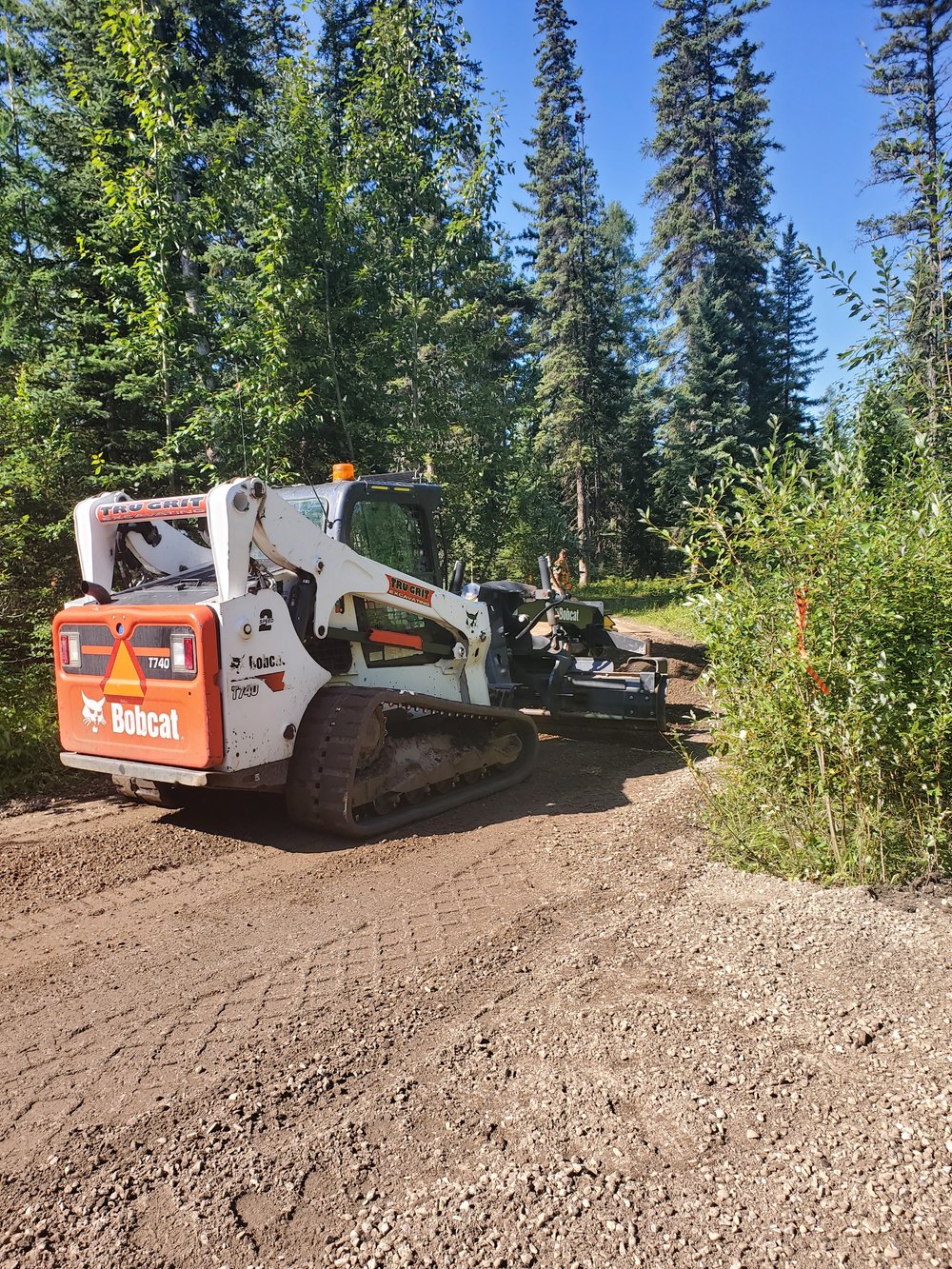 Laying of gravel on next part of trail
