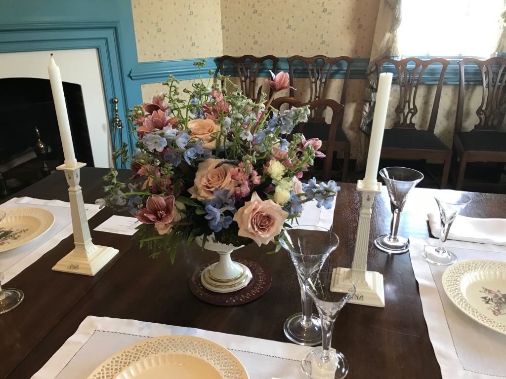 An arrangement in a soft palette complements the wallpaper in the Barraud dining room and was graciously provided by CW.