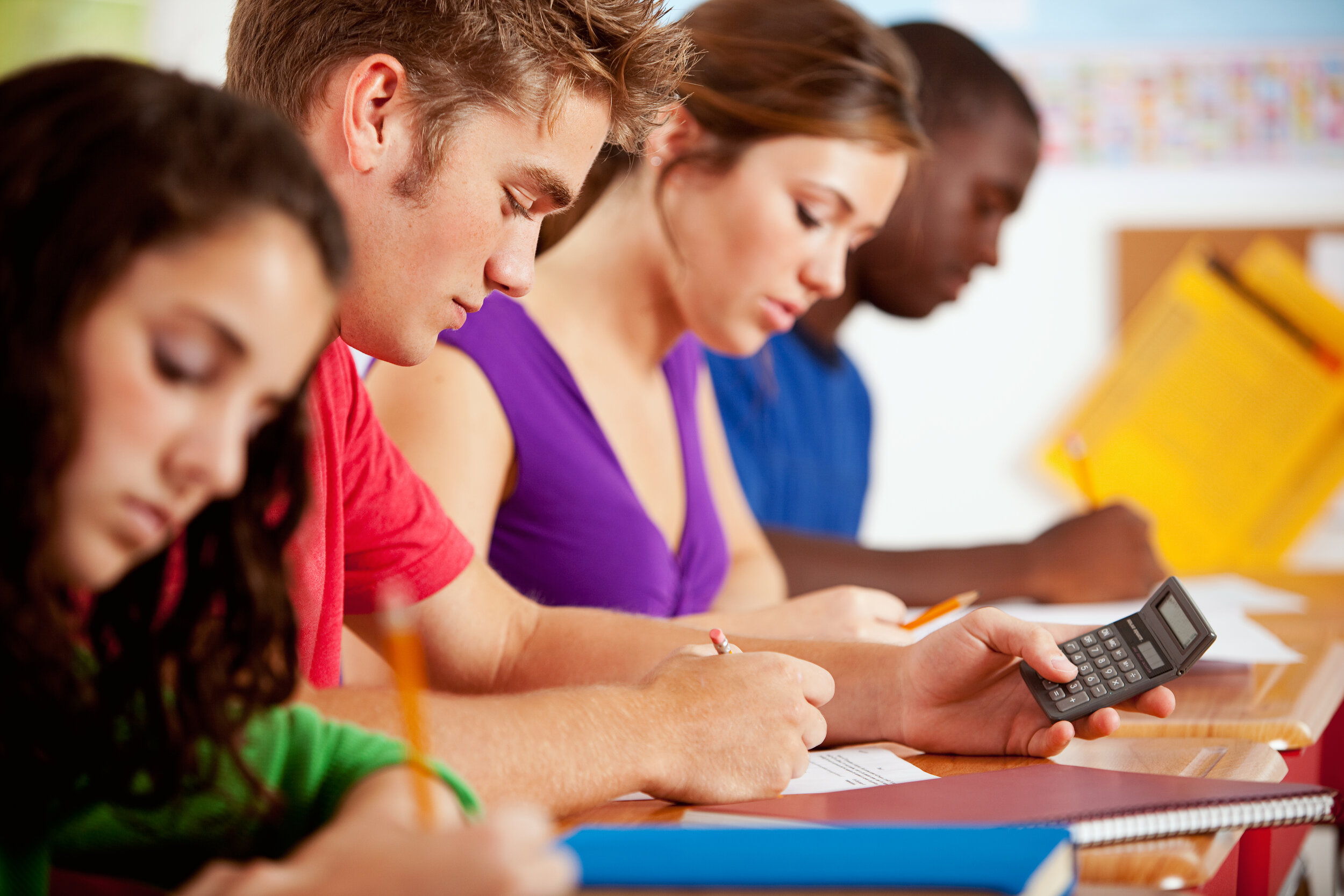 Students working on stats and probability math problems
