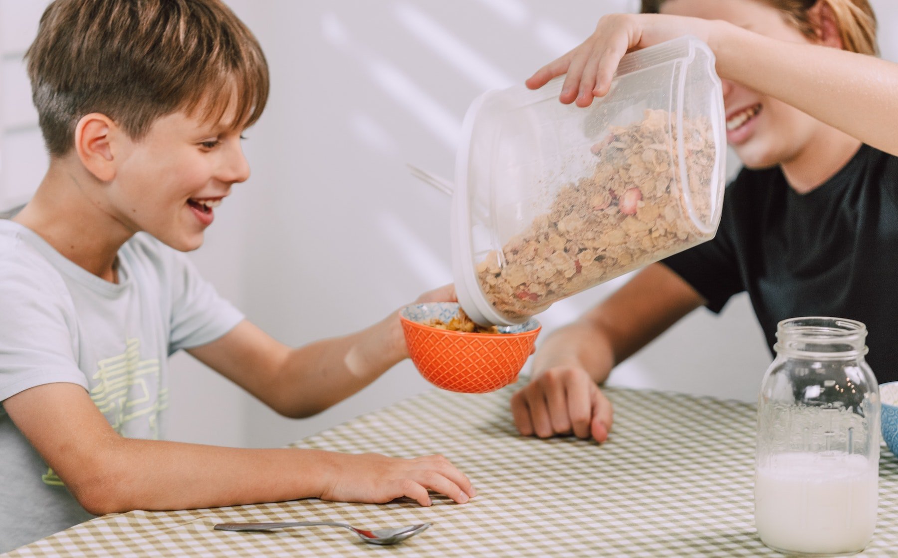 group of kids eating cereal