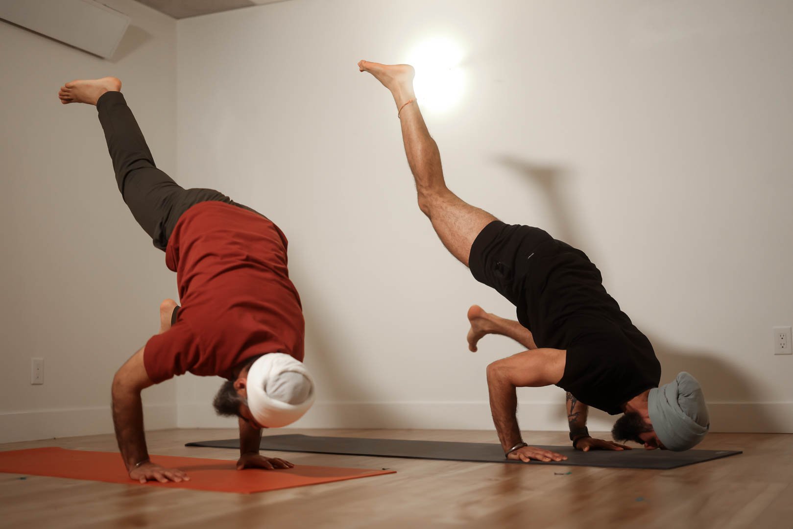 A student practicing an advanced yoga pose at Jai Yoga Studio Coquitlam, representing the 1-Year Practice Membership.