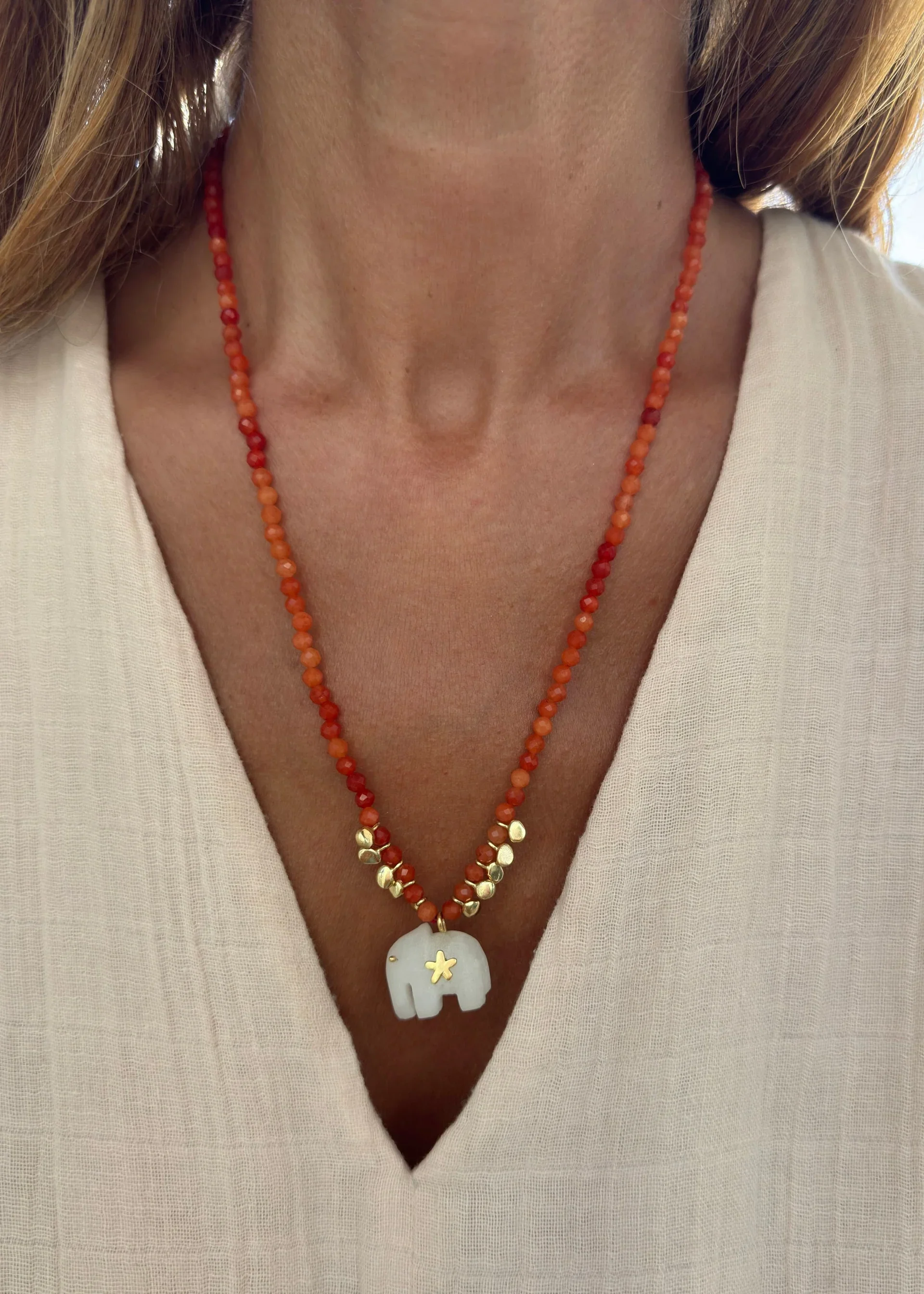 Sara Lashay Hathi necklace orange on model