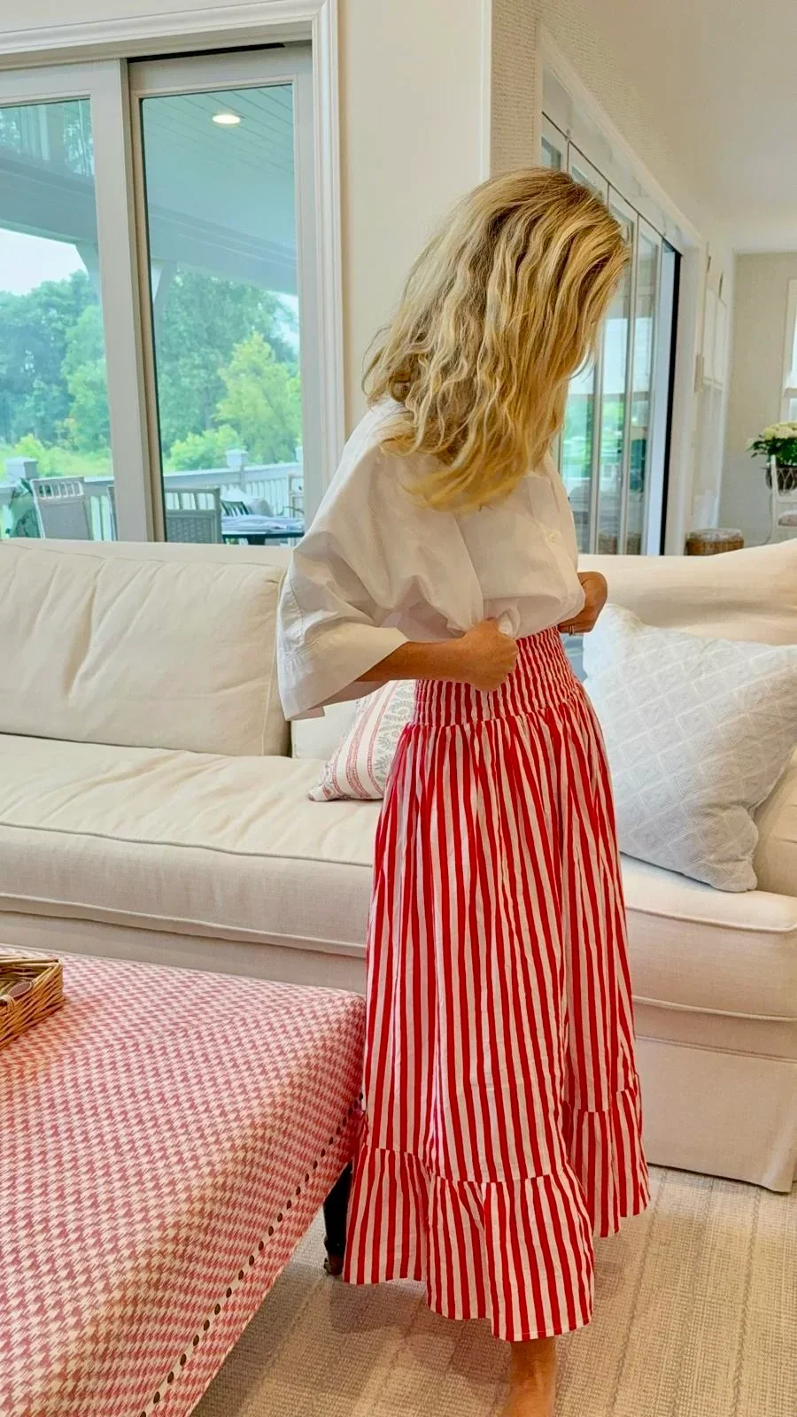 french model wearing a red and white stripe skirt