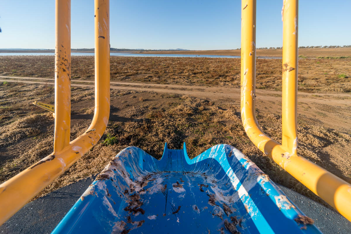 Low levels and the currently unusable recreation facilities that signify the direct link between the lake’s waters and the local population.