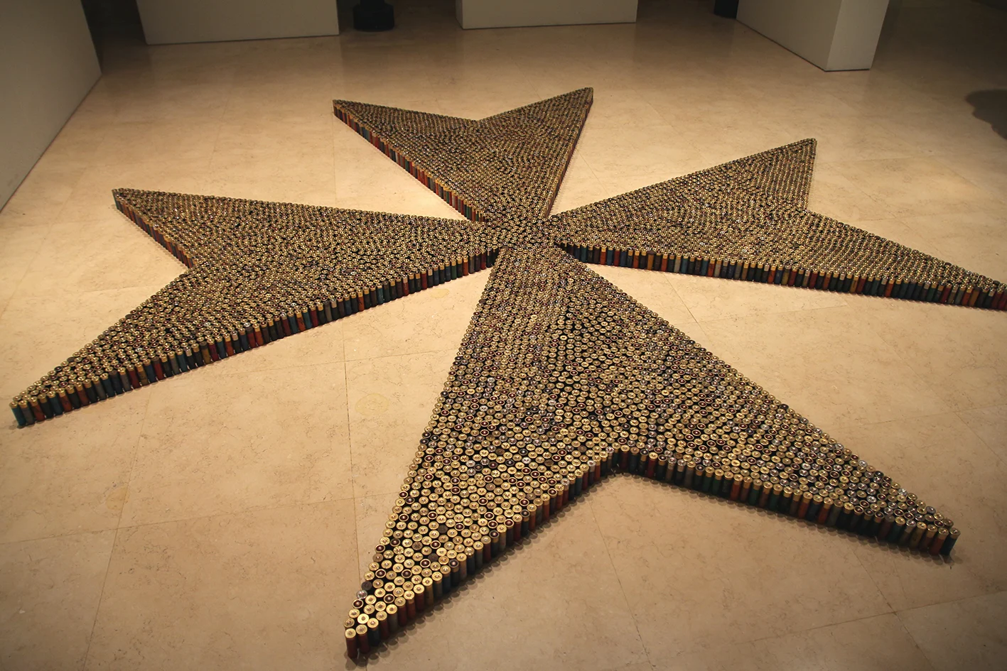 9,000 spent shotgun cartridges were used to create a large-scale installation of the ‘Maltese Cross’.