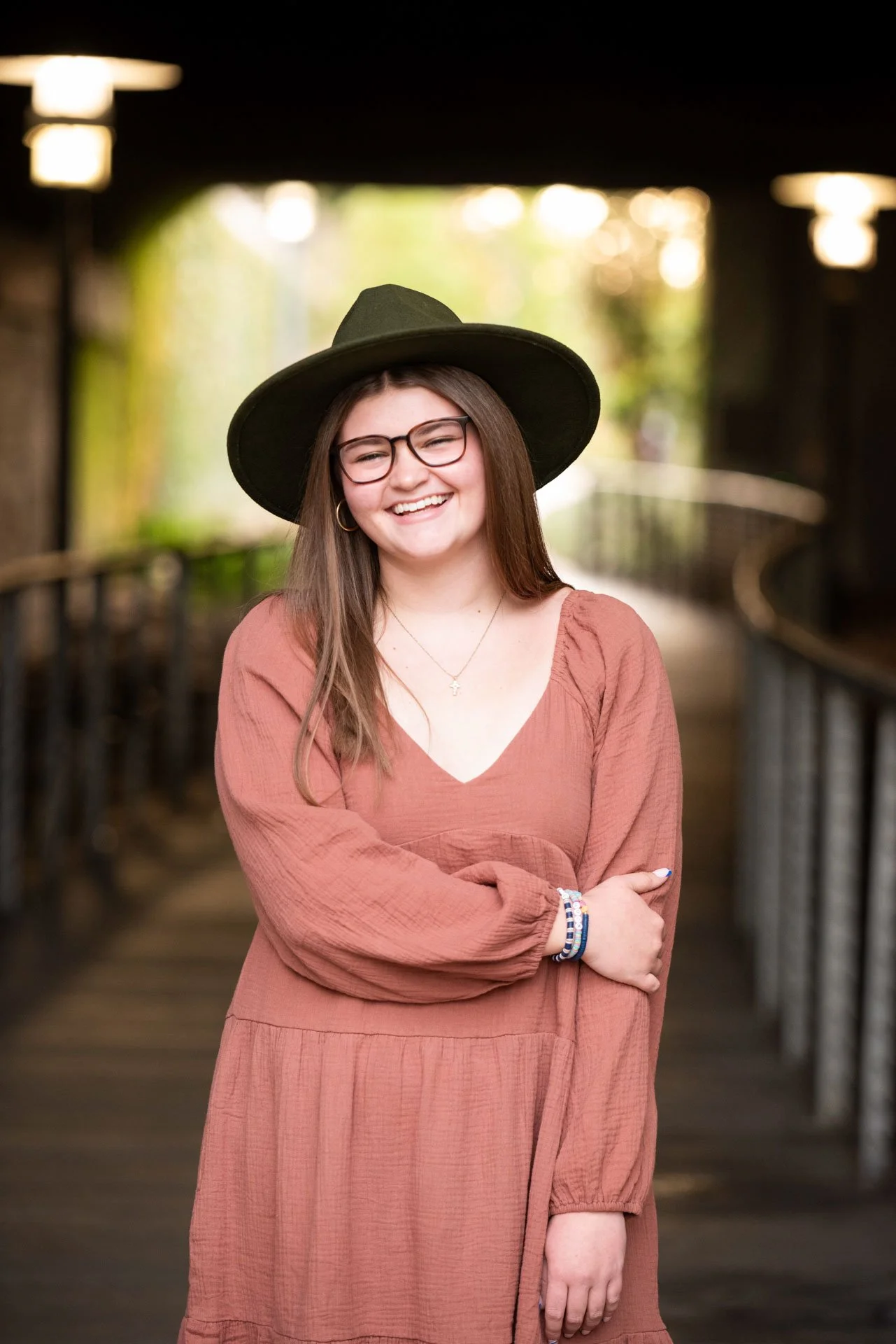 Senior girl in rust dress laughing over shoulder in fall Birmingham setting, Darling Dear Photo