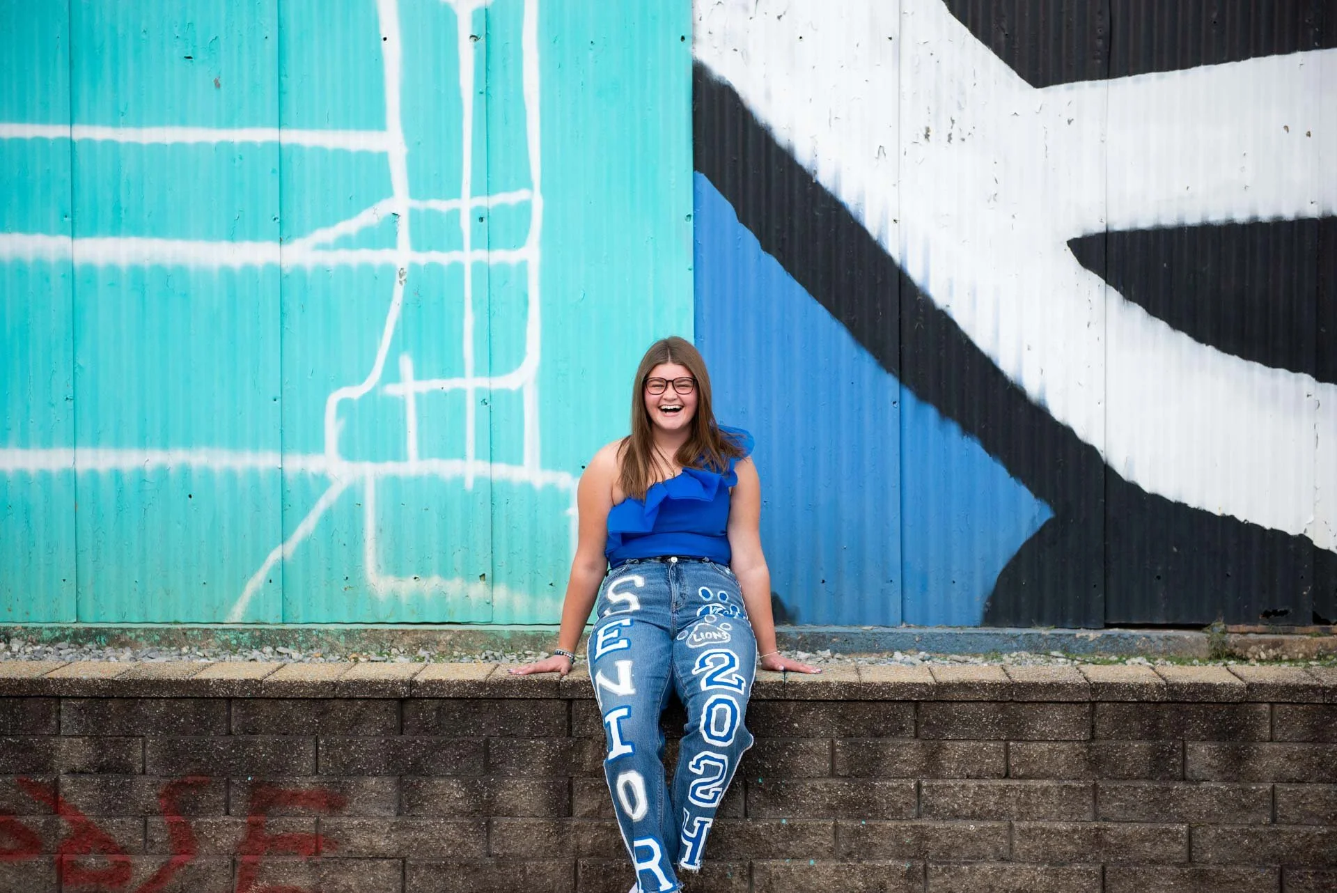 Senior portrait laughing in Birmingham Alabama garden, Darling Dear Photo