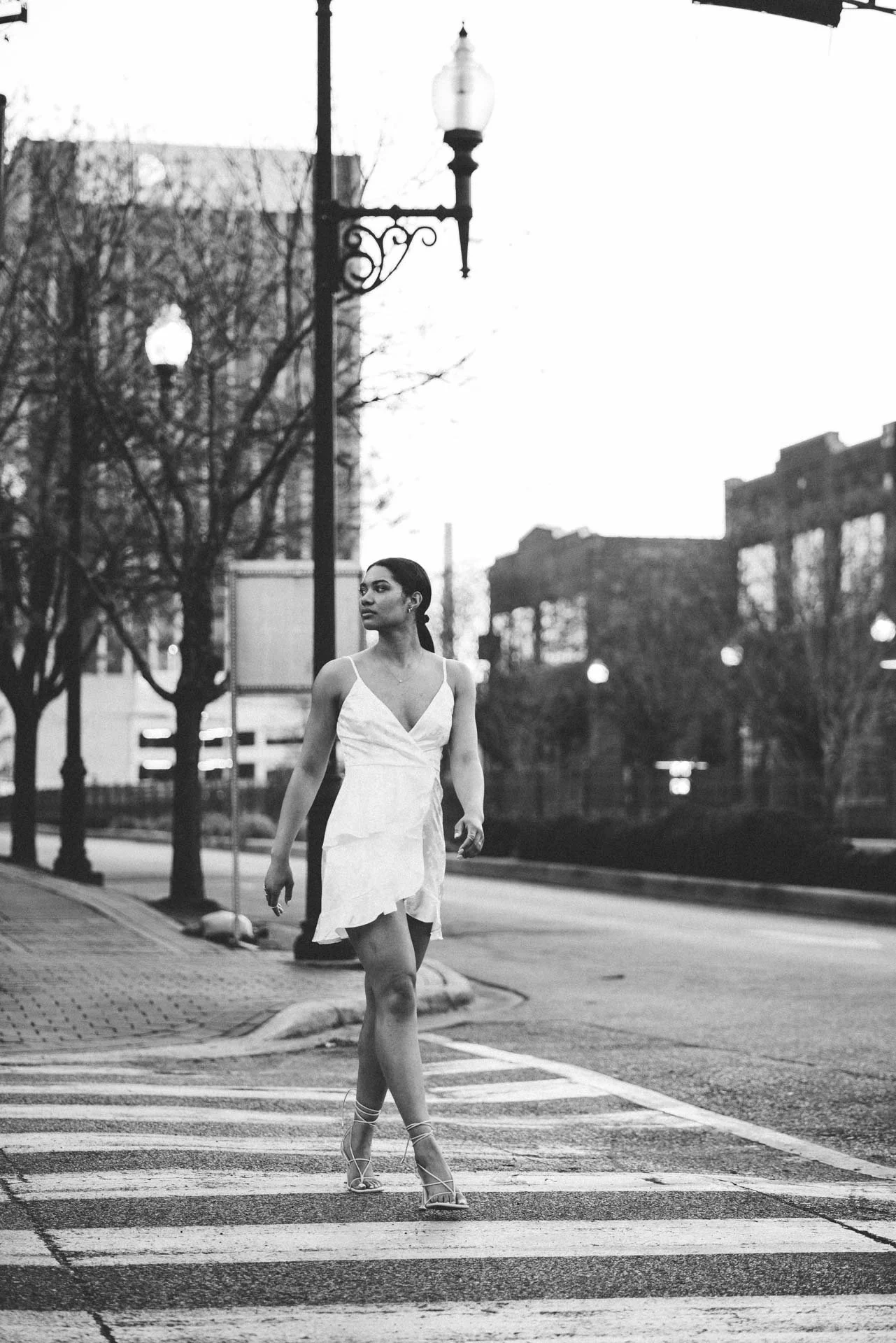 Black and white graduation portrait walking Birmingham Alabama crosswalk, Darling Dear Photo