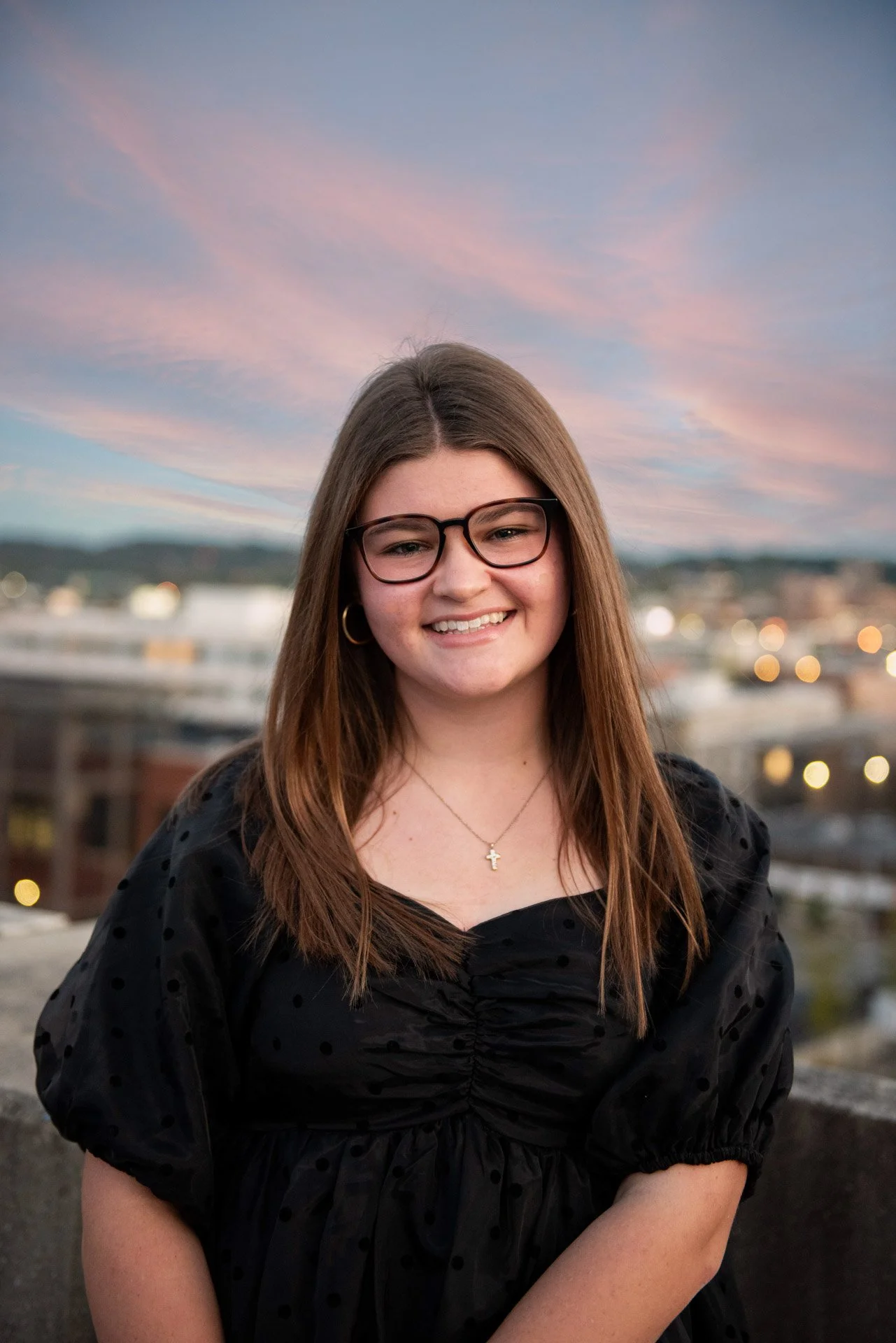 Senior girl smiling on Birmingham rooftop at sunset, Darling Dear Photo