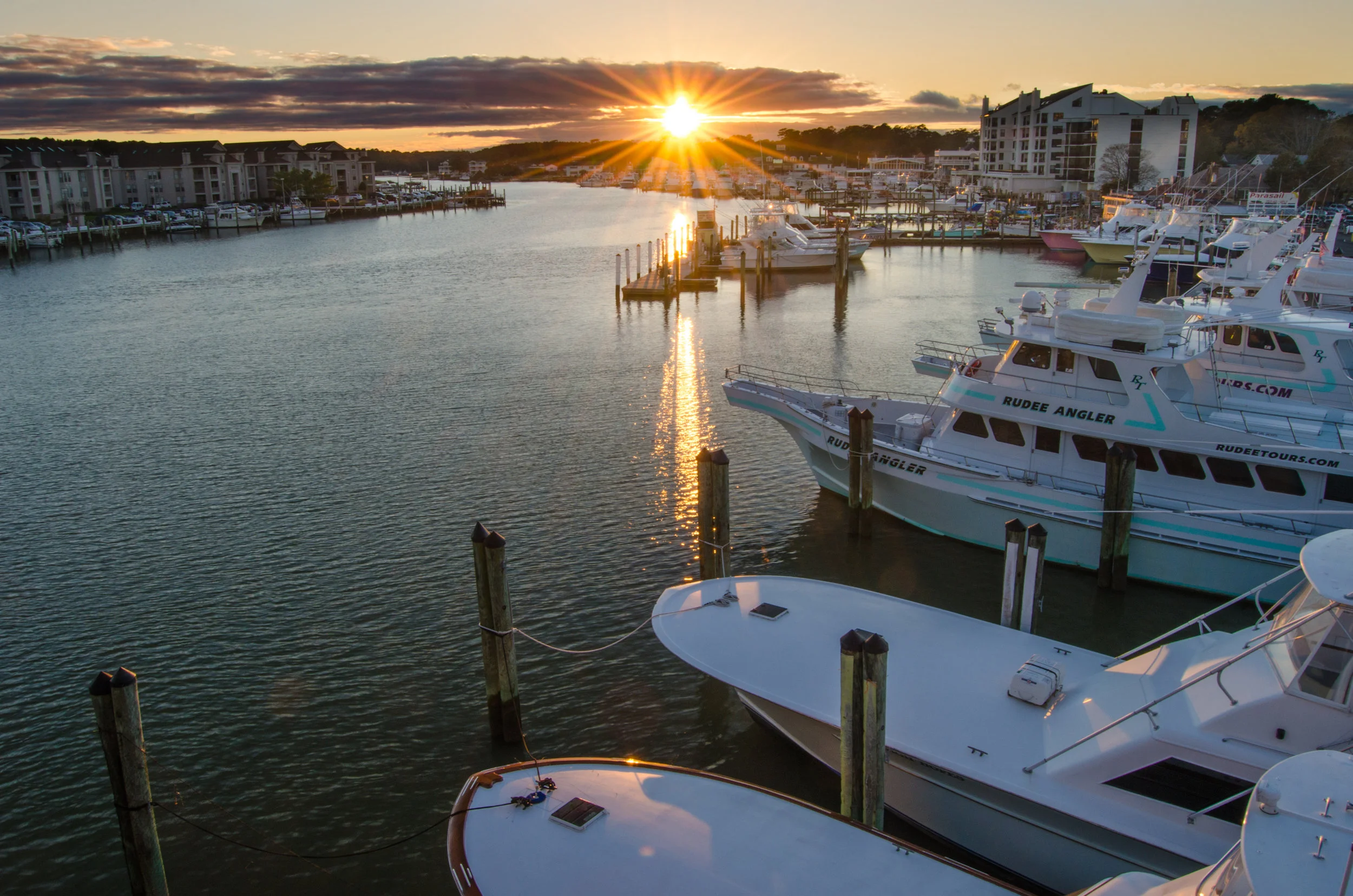 Sunset over boats at Rudee Inlet Marina in Virginia Beach, Virginia - sun flare.jpg