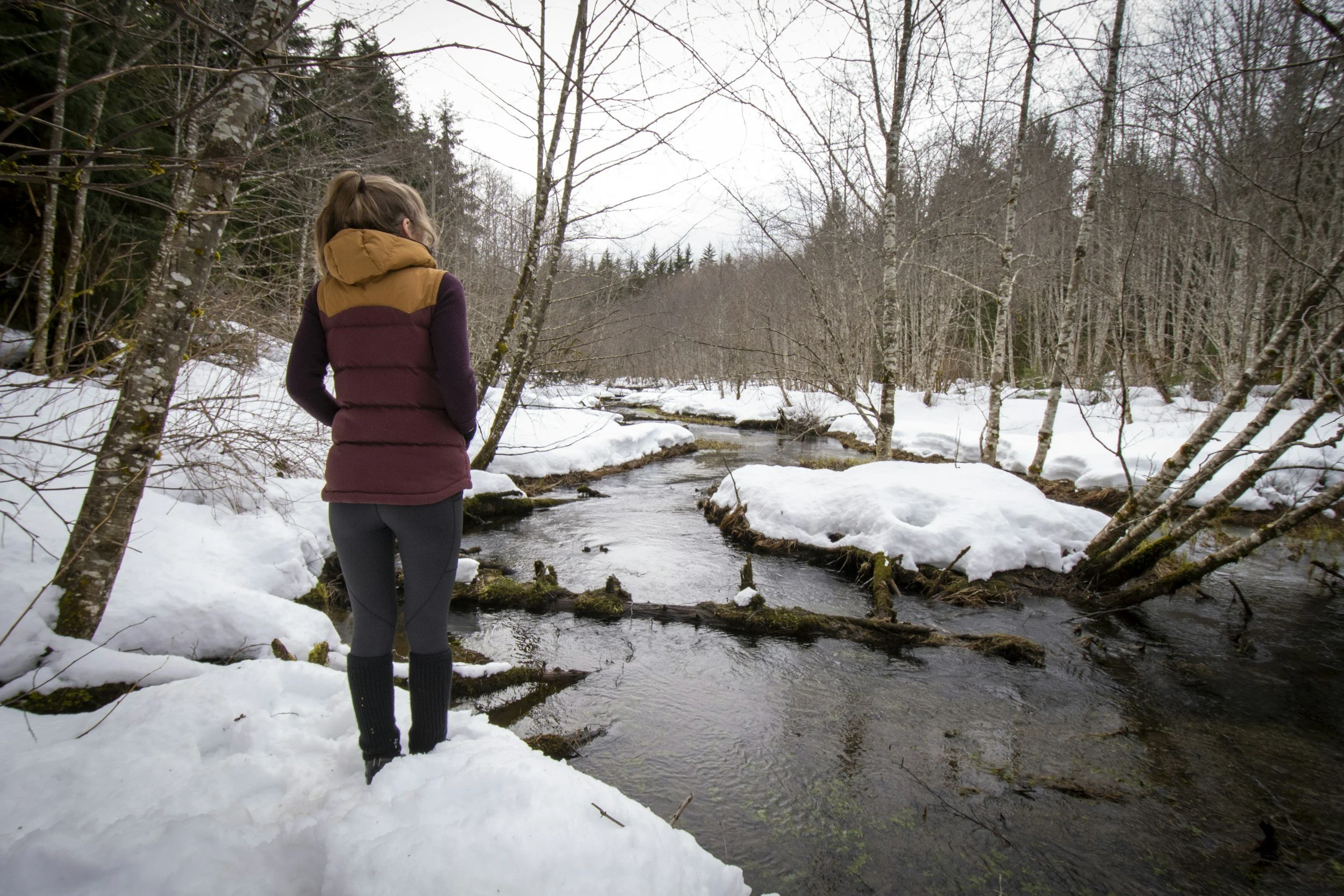 Winter hiking along a snowy stream and frozen waterfalls near Marquette, Michigan