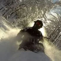 Snowmobiling on winter trails near Rippling River Resort in Marquette, Michigan