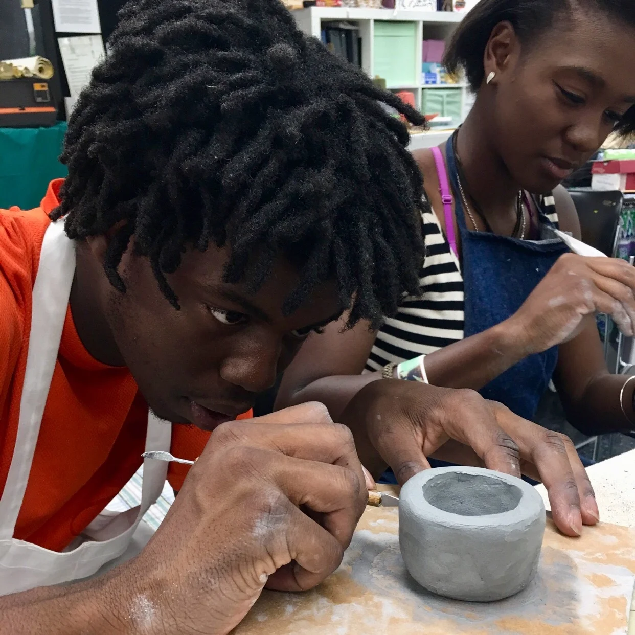kid+making+pottery.jpg