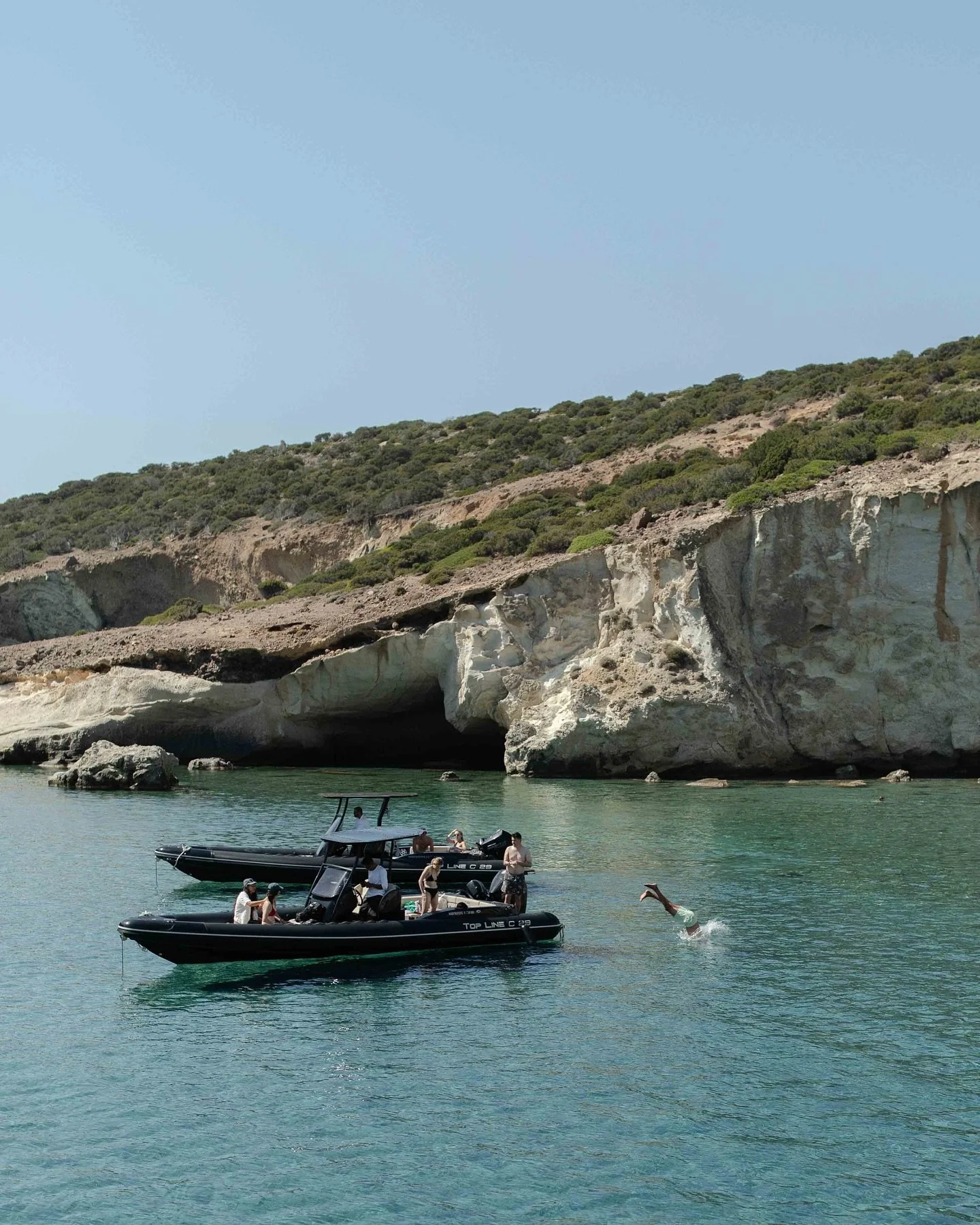 Milos by boat. Clear water, still air.
