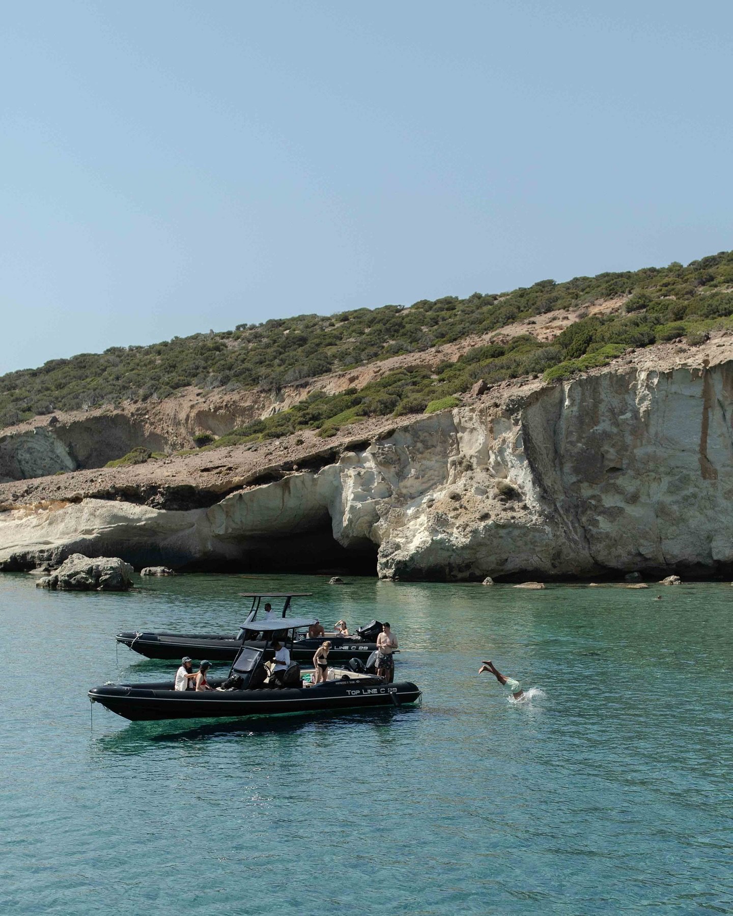 Milos by boat. Clear water, still air.