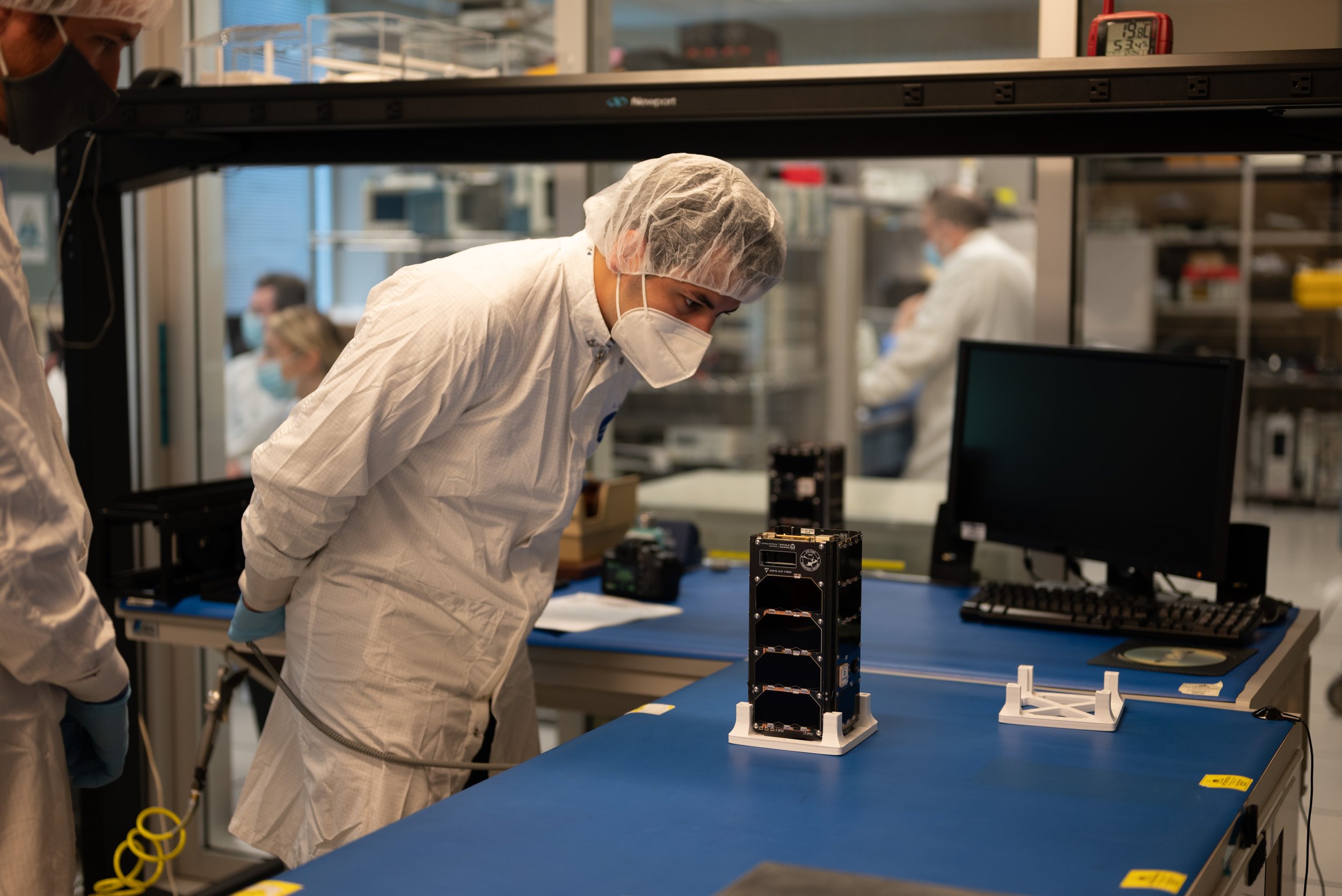 Jake from Nanoracks inspecting ORCASat