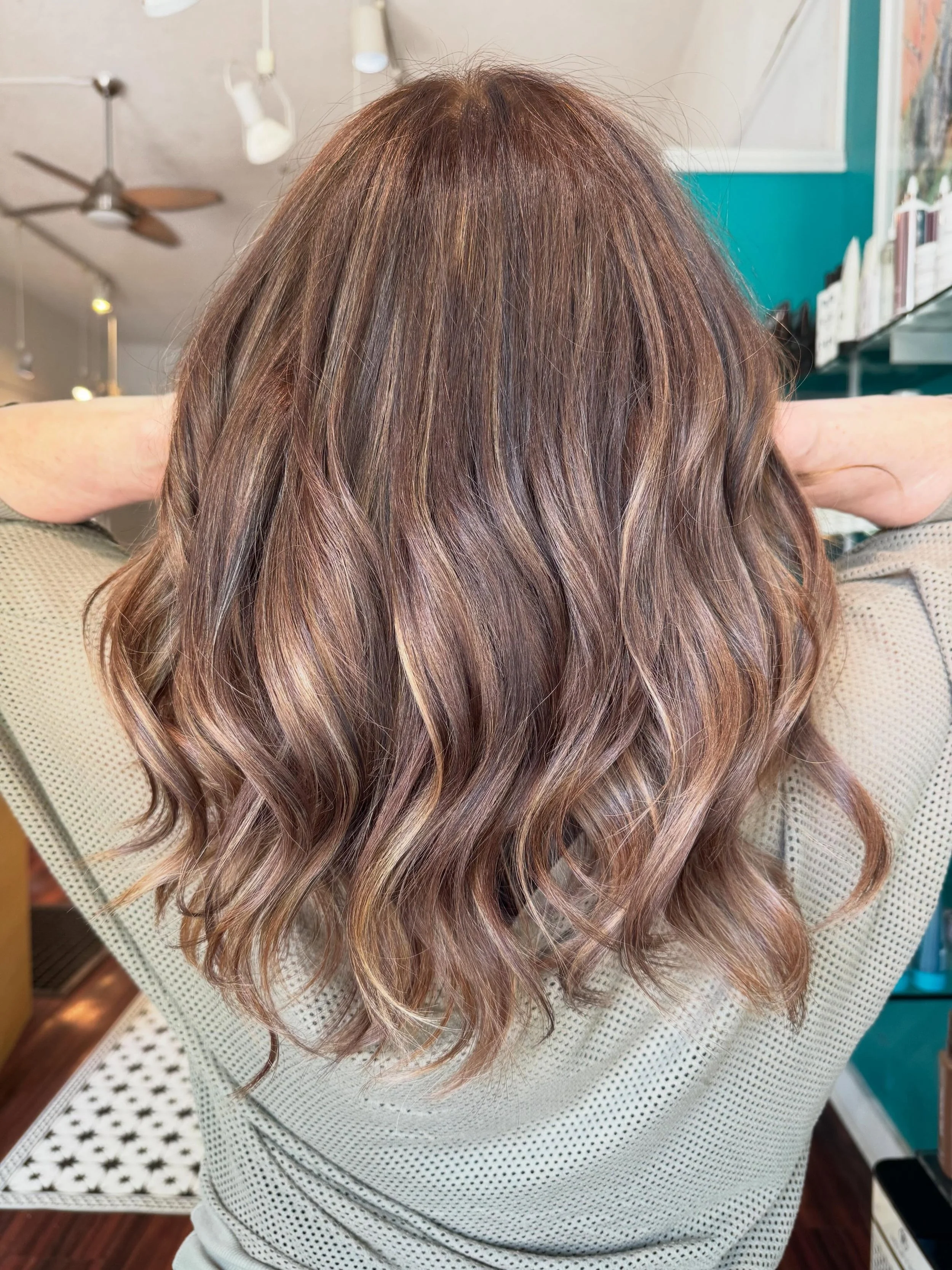 This client usually does her color touch-ups at home, but every so often we add some highlights for dimension along with a solid cut. You should&rsquo;ve seen it before the toner 😳 It lifted lighter than expected, so we went in with a darker toner a