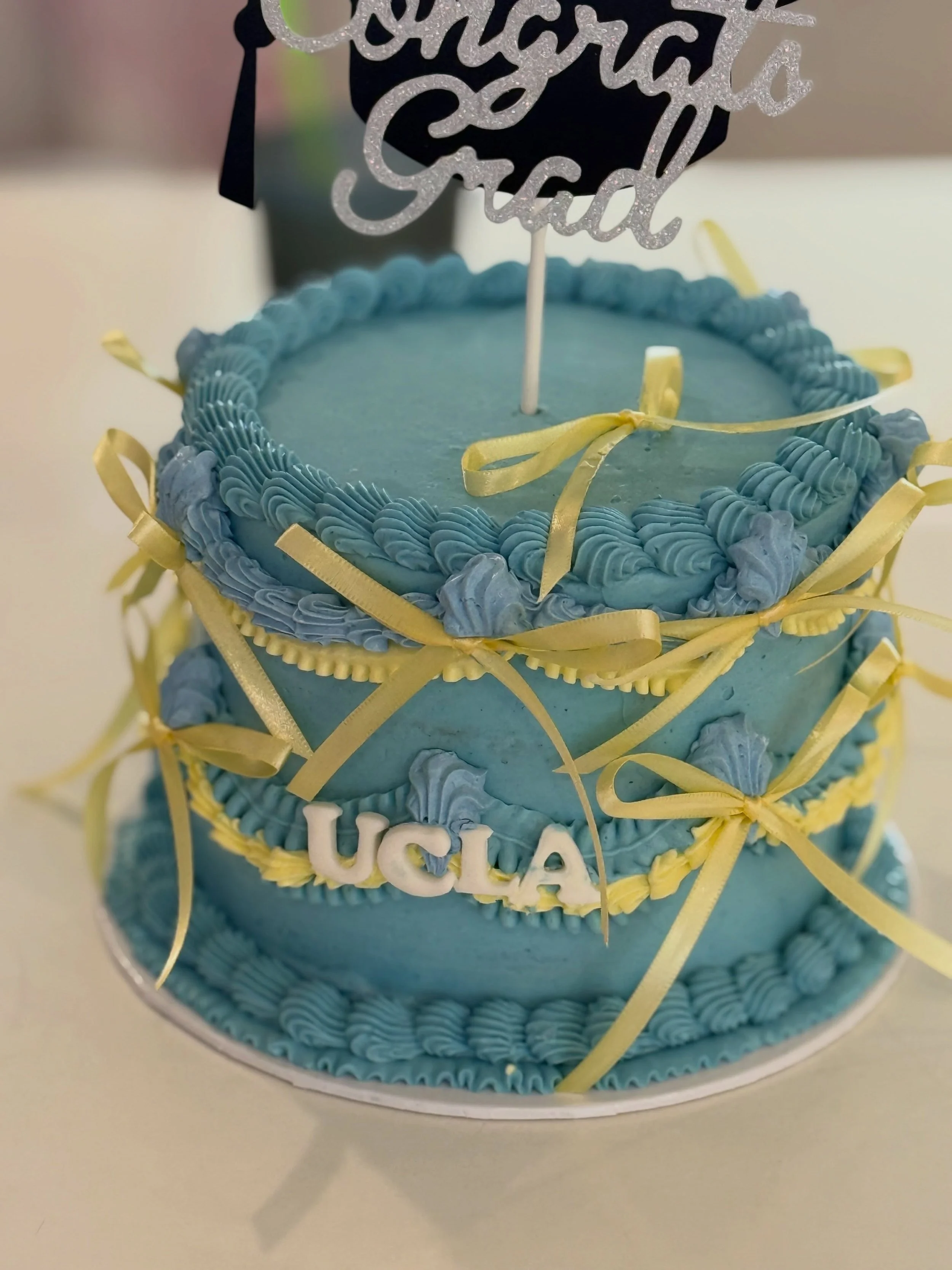 #tbt to UCLA grad weekend! 
.
.
.
.
.
Cupcake toppers @wendysballoons.co @wendyscalligraphy 
#ucla #graduation #cupcakes #buttercream