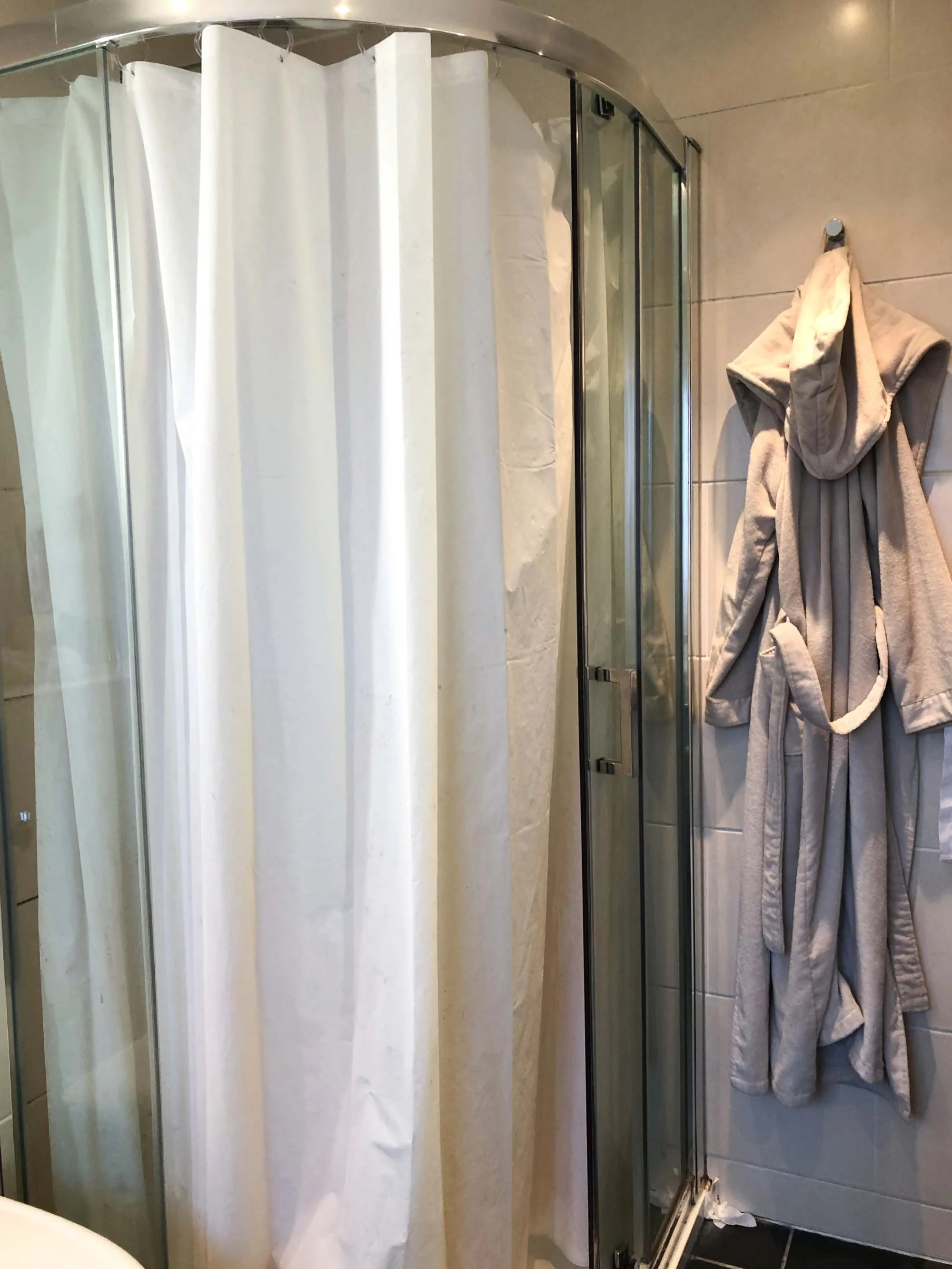 4 shower-curtain-hung-in-place-of-broken-door.jpg
