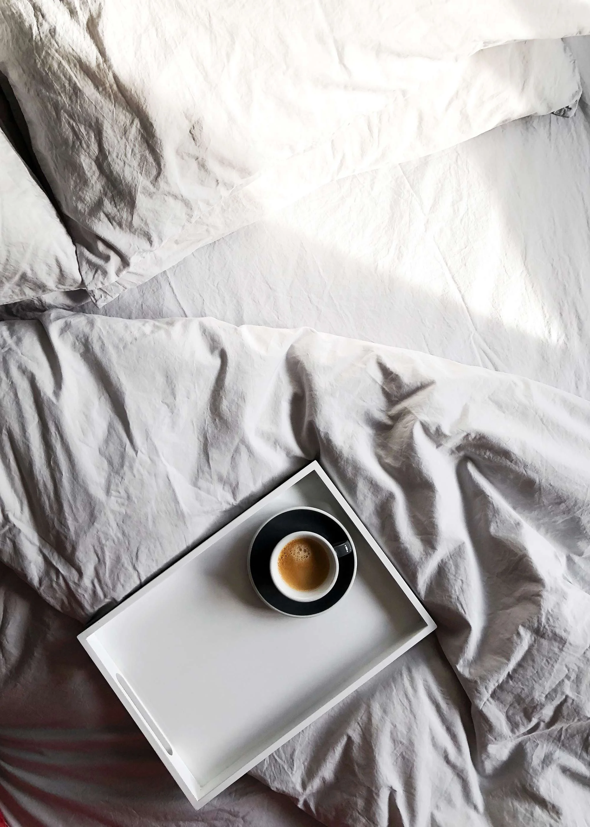 coffee-on-tray-on-grey-cotton-sheets.jpg