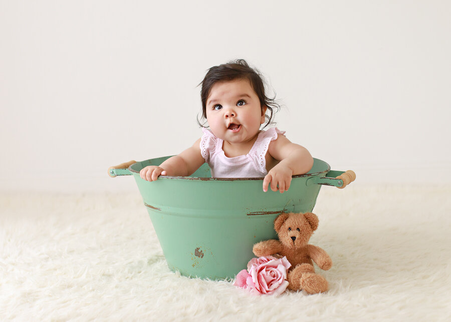 baby-in-bucket-pose.jpg