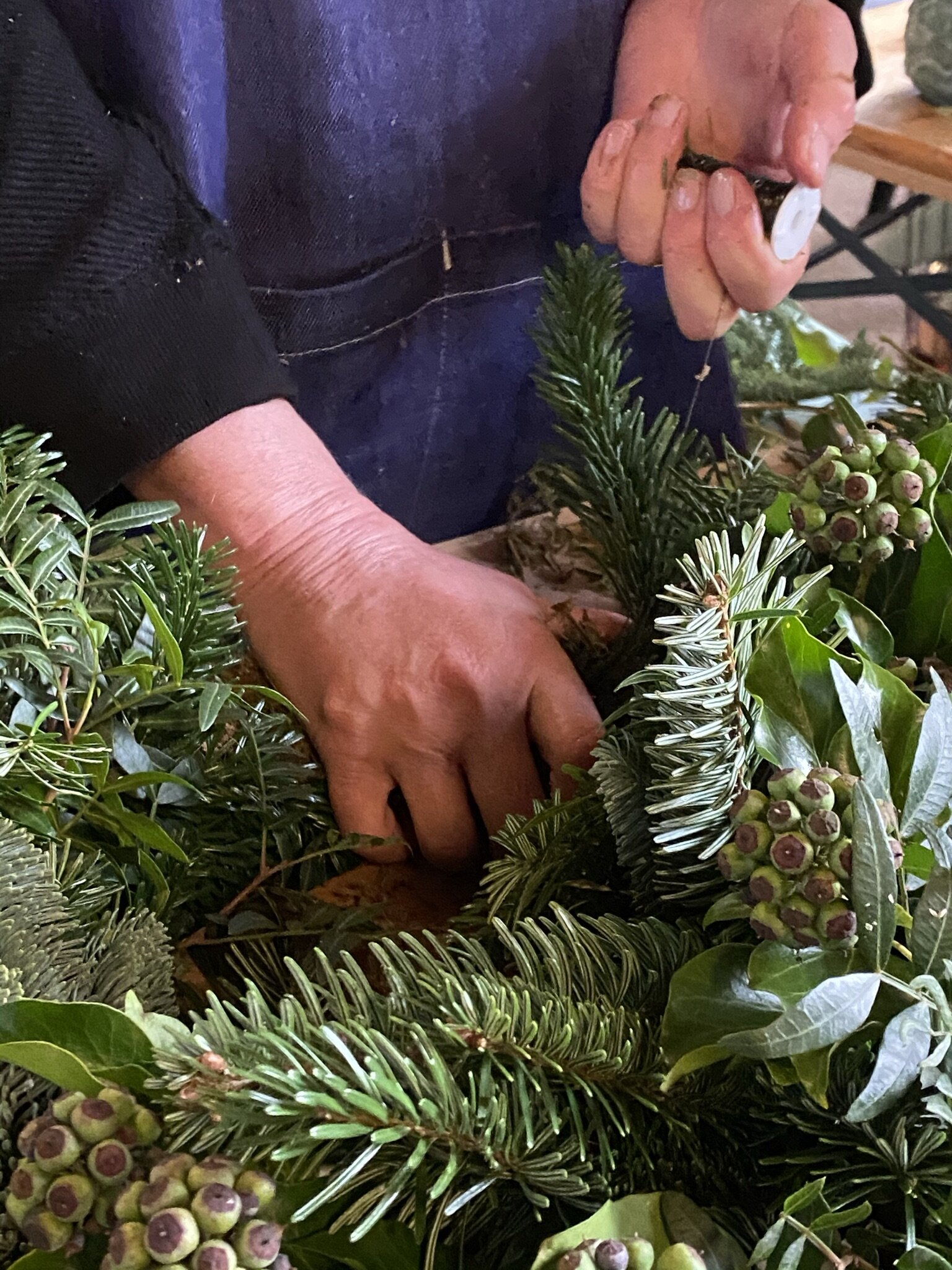 Student making a Christmas Wreath (Copy)