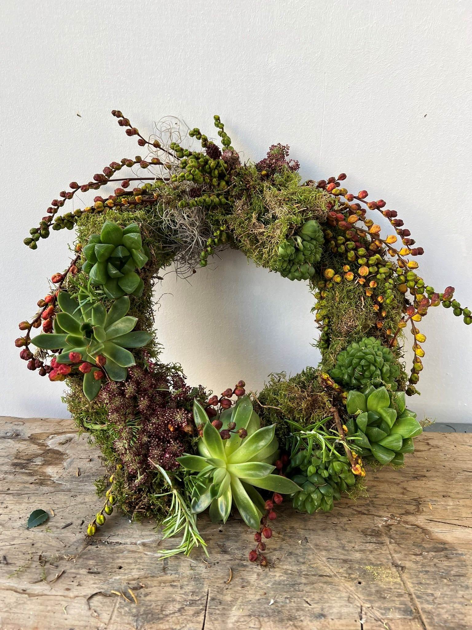 A variety of texture succulents and moss living wreath 