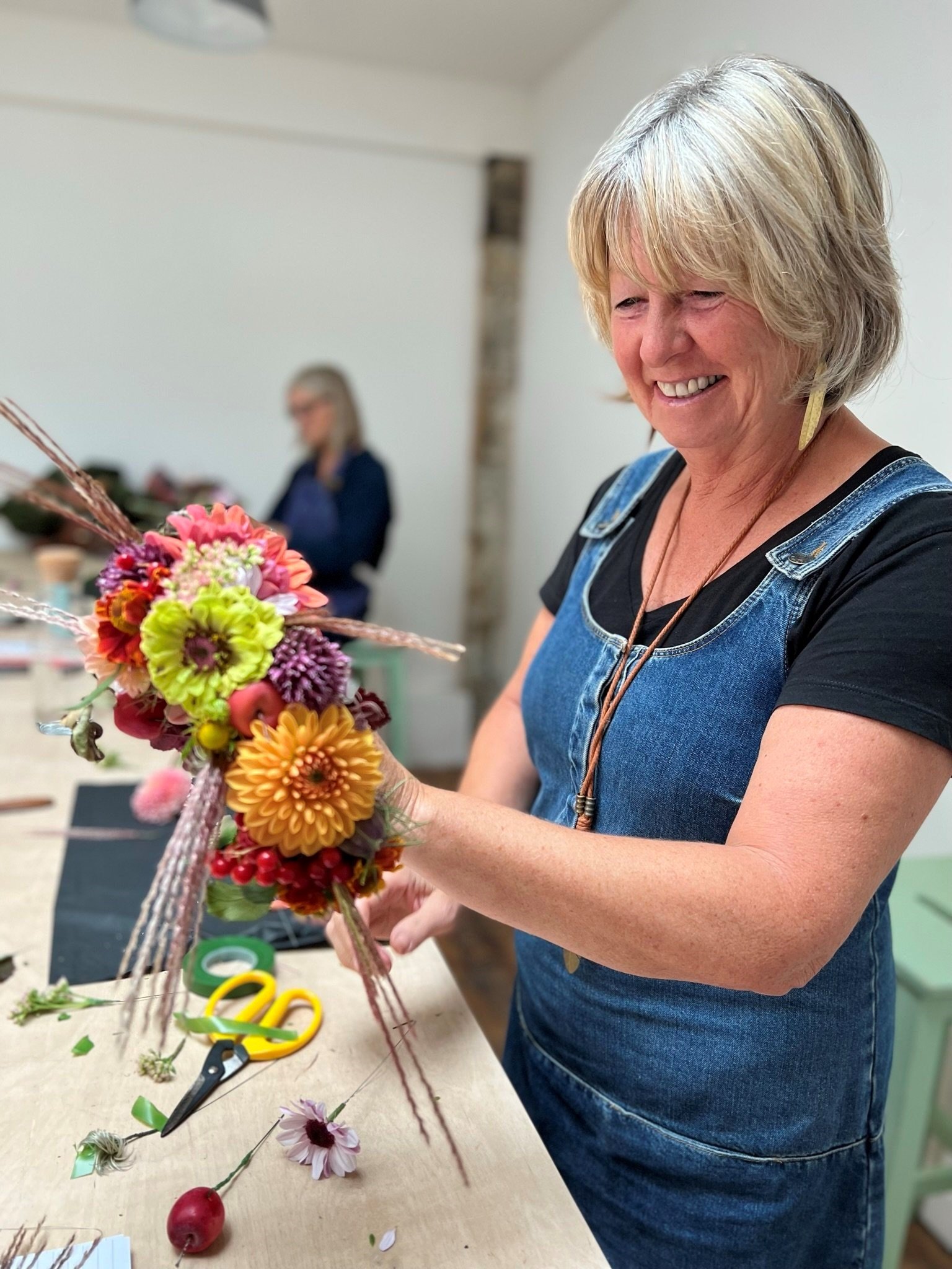 Student creating a flower crown at The Bath Flower School 