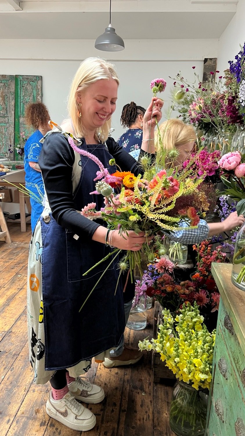 Student selecting British flowers on Sophie Powell, UFLO's flower crown workshop