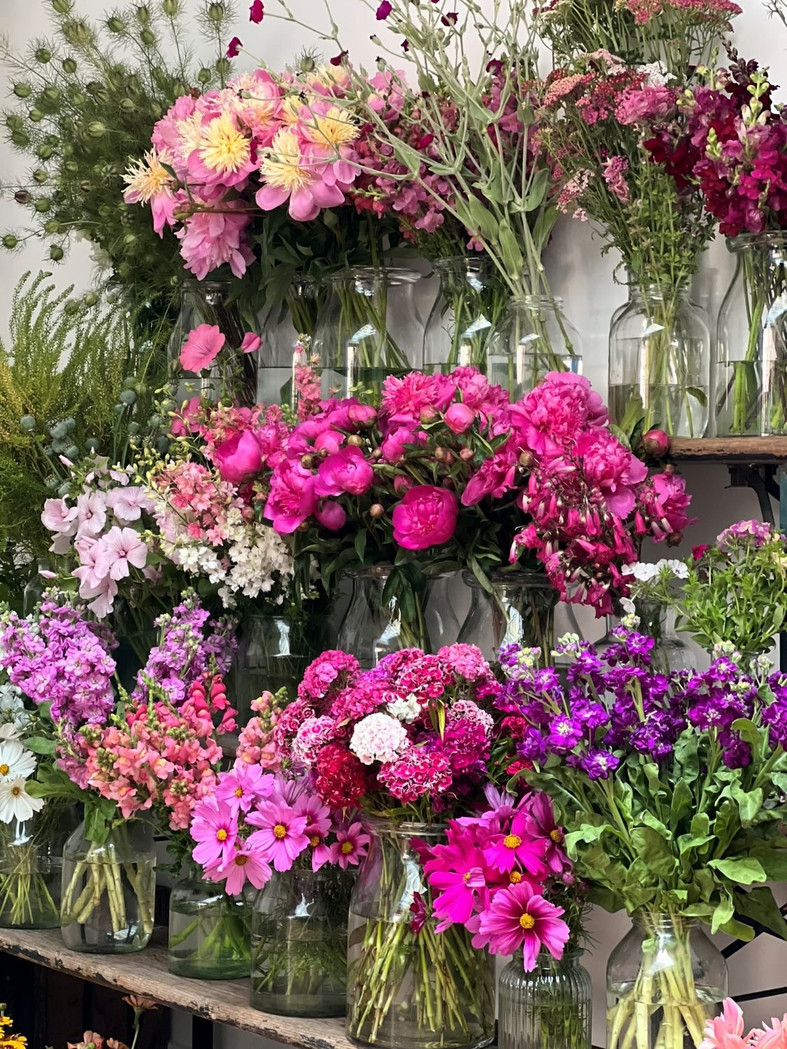 The Bath Flower School's stand full of brightly coloured British flowers