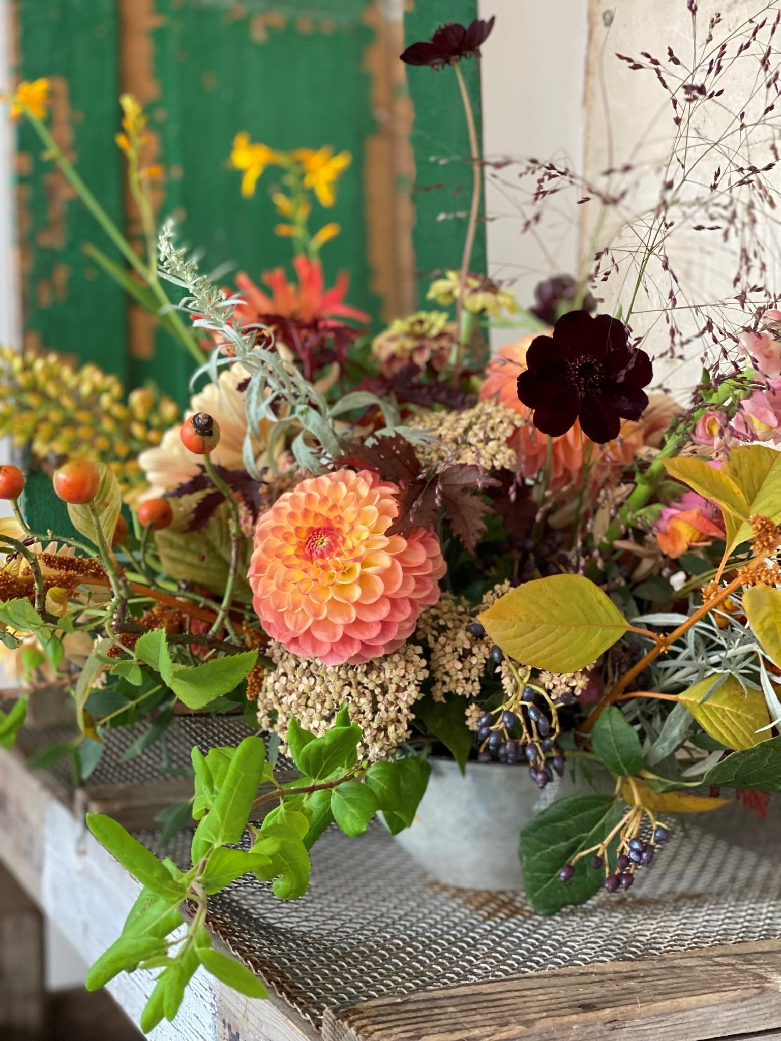 Vibrant table arrangement using British flowers on The Bath Flower School's DIY Wedding Flowers course
