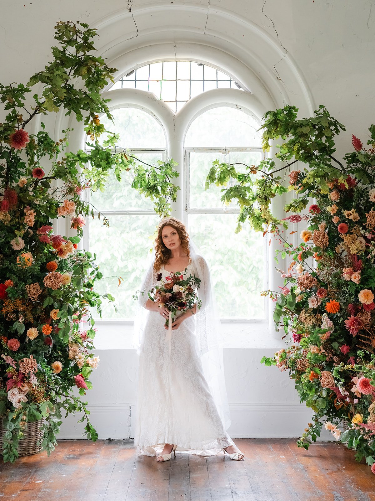 Bath wedding flower installation with bride and bridal bouquet