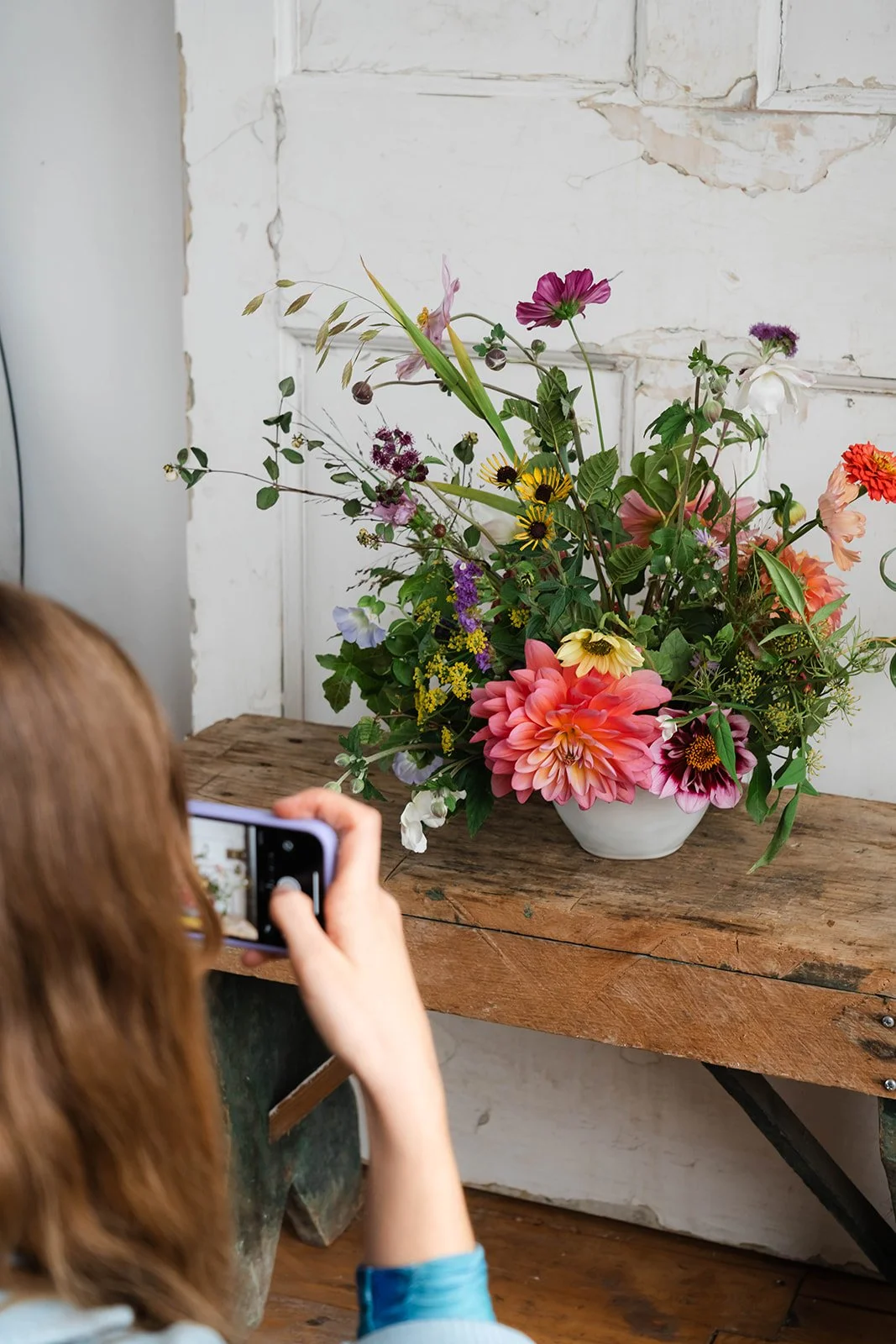 Bath flower school photography course student taking an image of her work
