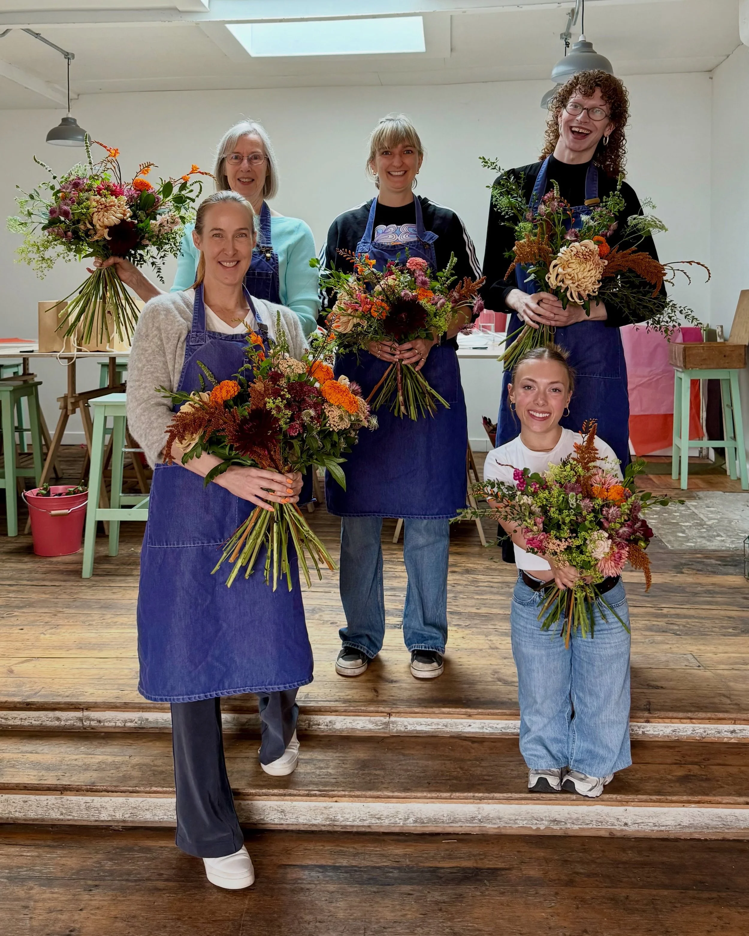 First day back after summer and what a joy to see the flower stand overflow with stunning autumn blooms. The season has truly arrived at the school.

Today, students mastered the spiral technique in the school room, transforming beautiful stems into 
