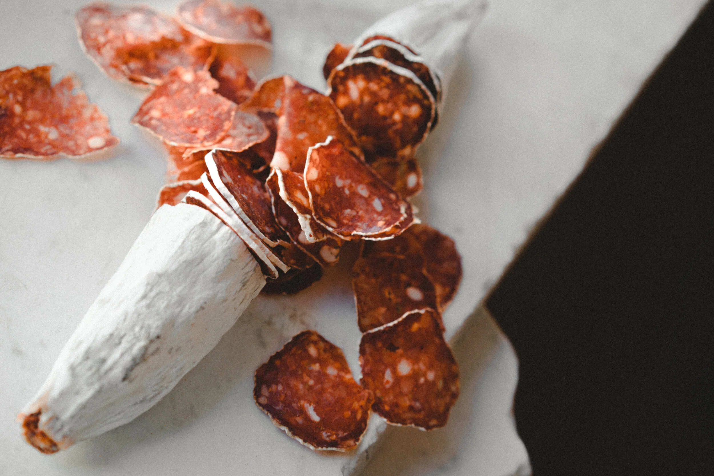 Pepperoni, partially sliced