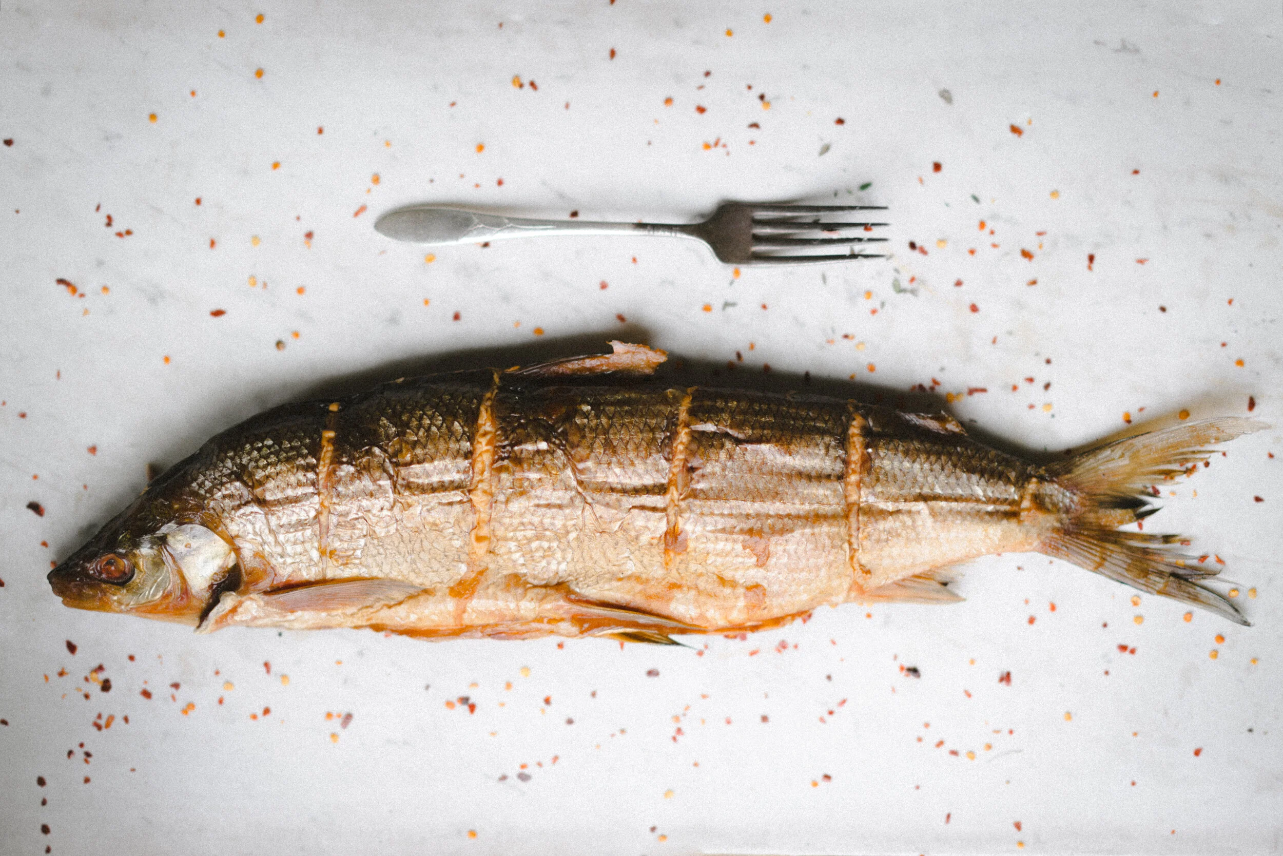 Whole Whitefish with Fork Next to It